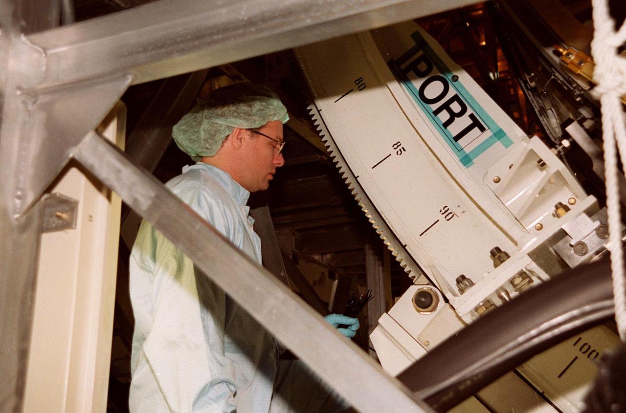 KENNEDY SPACE CENTER, FLA. -- In the Space Station Processing Facility, a worker checks the U.S. Laboratory Destiny as it rotates. A component of the International Space Station, Destiny is scheduled to fly on mission STS-98 in early 2001. During the mission, the crew will install the Lab during a series of three space walks. The STS-98 mission will provide the station with science research facilities and expand its power, life support and control capabilities. The U.S. Lab module continues a long tradition of microgravity materials research, first conducted by Skylab and later Shuttle and Spacelab missions. Destiny is expected to be a major feature in future research, providing facilities for biotechnology, fluid physics, combustion, and life sciences research.<font size="3"