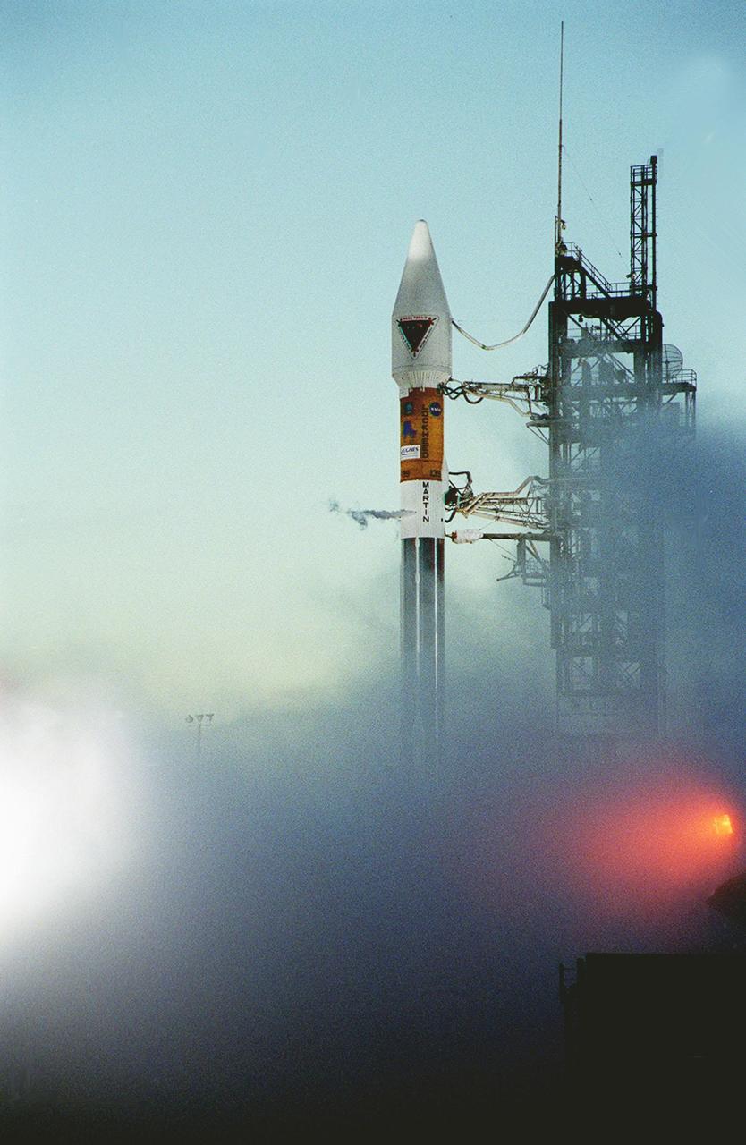 At dawn on Launch Pad 36A, Cape Canaveral Air Force Station, an Atlas IIA/Centaur rocket is fueled for launch of NASA’s Tracking and Data Relay Satellite (TDRS-H). One of three satellites (labeled H, I and J) being built by the Hughes Space and Communications Company, the latest TDRS uses an innovative springback antenna design. A pair of 15-foot-diameter, flexible mesh antenna reflectors fold up for launch, then spring back into their original cupped circular shape on orbit. The new satellites will augment the TDRS system’s existing Sand Ku-band frequencies by adding Ka-band capability. TDRS will serve as the sole means of continuous, high-data-rate communication with the Space Shuttle, with the International Space Station upon its completion, and with dozens of unmanned scientific satellites in low earth orbit