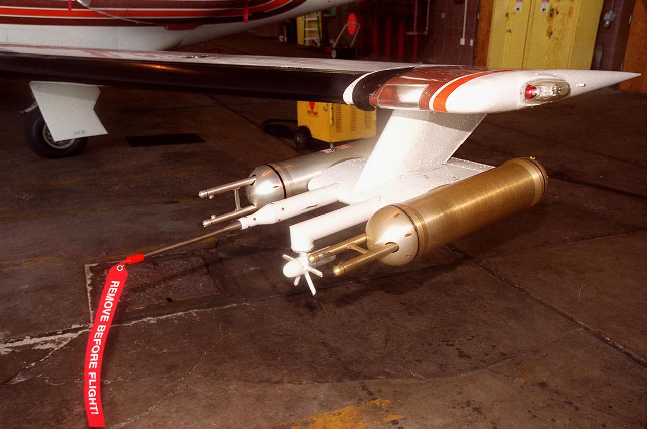 Attached to the wing of a Cessna Citation aircraft are cloud physics probes that measure the size, shape and number of ice and water particles in clouds. The plane is also equipped with field mills, used to measure electric fields. The plane is being flown into anvil clouds in the KSC area as part of a study to review and possibly modify lightning launch commit criteria. The weather study could lead to improved lightning avoidance rules and fewer launch scrubs for the Space Shuttle and other launch vehicles on the Eastern and Western ranges.; More information about the study can be found in <a href="http://www-pao.ksc.nasa.gov/kscpao/release/2000/56-00.htm">Release No. 56-00</a>