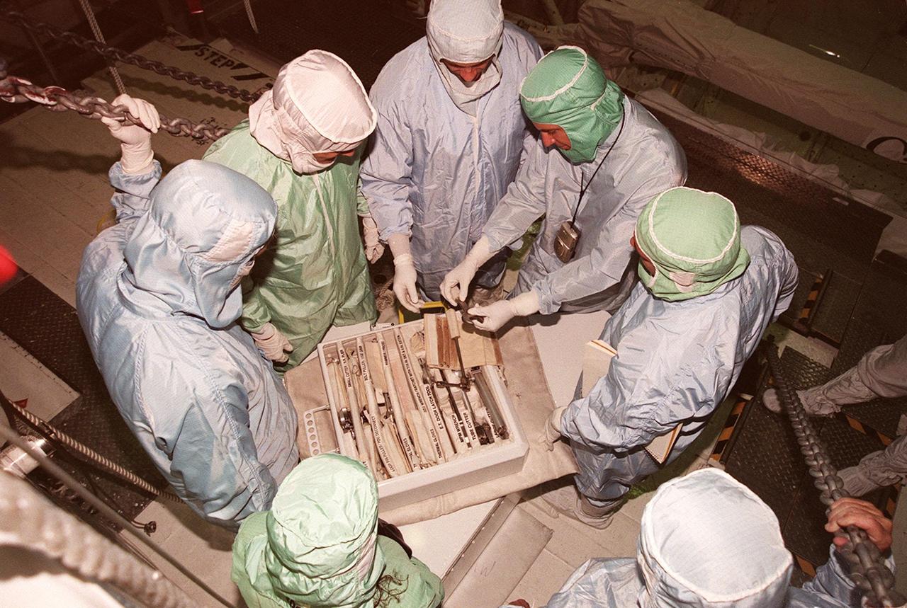 Checking out the tools they will be using on the STS-92 mission are Mission Specialists Jeff Wisoff (left) and Michael Lopez-Alegria (center), while a Boeing worker looks on. They are in the Orbiter Processing Facility bay 1 where Discovery is being outfitted for the mission. They and other crew members Commander Brian Duffy, Pilot Pam Melroy and Mission Specialists Koichi Wakata, Leroy Chiao and Bill McArthur are taking part in Crew Equipment Interface Test activities. STS-92 is scheduled to launch Oct. 5 on Shuttle Discovery from Launch Pad 39A on the fifth flight to the International Space Station. Discovery will carry the Integrated Truss Structure (ITS) Z1, Pressurized Mating Adapter 3, Ku-band Communications System, and Control Moment Gyros (CMGs)