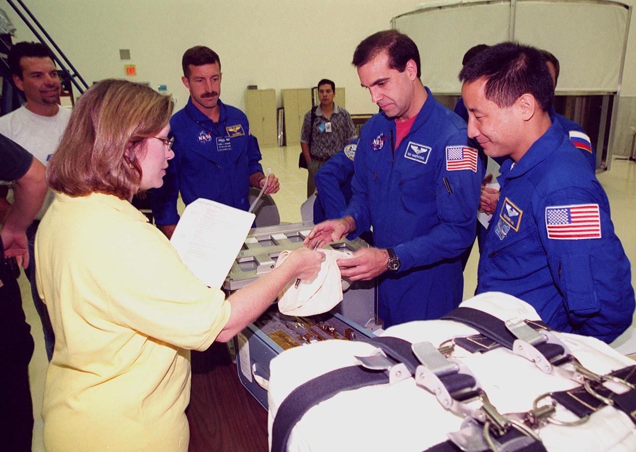KENNEDY SPACE CENTER, FLA. -- During Crew Equipment Interface Test activities at SPACEHAB, STS-106 crew members check out some of the equipment they will be using on their mission to the International Space Station. At left is Mission Specialist Daniel C. Burbank; at right are Mission Specialists Richard A. Mastracchio and Edward T. Lu. Malenchenko and Morukov represent the Russian Aviation and Space Agency. STS-106 is scheduled to launch Sept. 8, 2000, at 8:31 a.m. EDT from Launch Pad 39B on an 11-day mission. The seven-member crew will prepare the Space Station for its first resident crew and begin outfitting the newly arrived Zvezda Service Module. They will perform support tasks on orbit, transfer supplies and prepare the Zvezda living quarters for the first long-duration crew, dubbed “Expedition One,” which is due to arrive at the Station in late fall