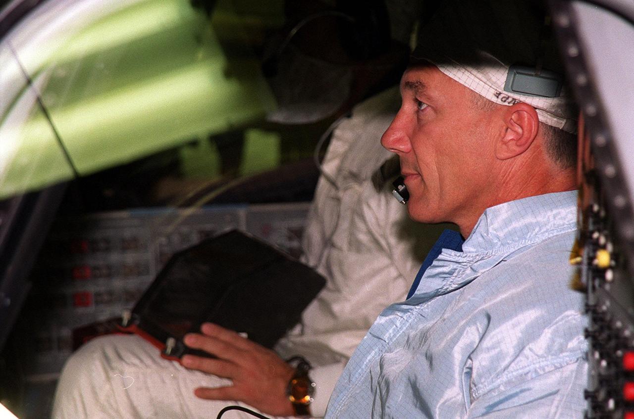STS-106 Mission Commander Terrence W. Wilcutt checks out the windows in Space Shuttle orbiter Atlantis in Orbiter Processing Facility bay 3. He and the other crew members Pilot Scott D. Altman and Mission Specialists Edward T. Lu, Daniel C. Burbank, Yuri I. Malenchenko, Boris V. Morukov and Richard A. Mastracchio are taking part in Crew Equipment Interface Test (CEIT) activities. Malenchenko and Morukov represent the Russian Aviation and Space Agency. On the 11-day mission, the seven-member crew will perform support tasks on orbit, transfer supplies and prepare the living quarters in the newly arrived Zvezda Service Module for the first long-duration crew, dubbed "Expedition One," which is due to arrive at the Station in late fall. STS-106 is scheduled to launch Sept. 8, 2000, at 8:31 a.m. EDT from Launch Pad 39B