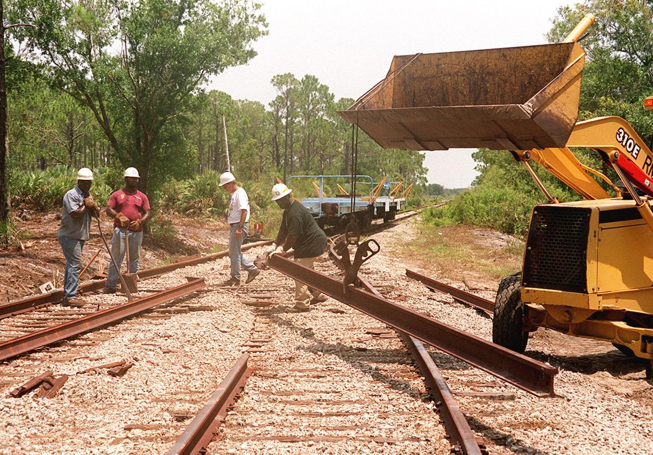 The railroad tracks are under repair at Kennedy Space Center. This section of track is located on KSC property, just north of the NASA Causeway in the KSC Industrial Area. The repairs were required following the minor derailment of two solid rocket booster segment cars on July 18