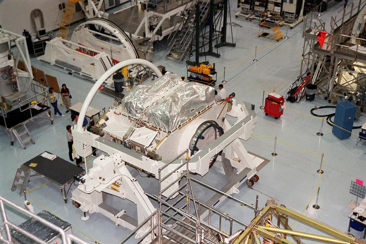 The Zenith-1 (Z-1) Truss, the cornerstone truss of the Space Station, is shown on the floor of the Space Station Processing Facility. The Z-1 Truss was officially turned over to NASA from The Boeing Co. on July 31. It is scheduled to fly in Space Shuttle Discovery's payload pay on STS-92 targeted for launch Oct. 5, 2000. The Z-1 is considered a cornerstone truss because it carries critical components of the Station's attitude, communications, thermal and power control systems as well as four control moment gyros, high and low gain antenna systems, and two plasma contactor units used to disperse electrical charge build-ups. The Z-1 truss and a Pressurized Mating Adapter (PMA-3), also flying to the Station on the same mission, will be the first major U.S. elements flown to the ISS aboard the Shuttle since the launch of the Unity element in December 1998