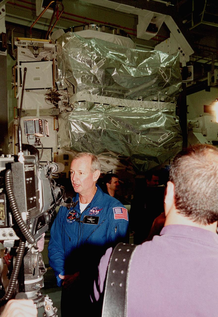 The Zenith-1 (Z-1) Truss is officially presented to NASA by The Boeing Co. on the Space Station Processing Facility floor on July 31. STS-92 Commander Col. Brian Duffy discusses the significance of the Z-1 Truss during a press conference after the presentation. The Z-1 Truss is the cornerstone truss of the International Space Station and is scheduled to fly in Space Shuttle Discovery's payload pay on STS-92 targeted for launch Oct. 5, 2000. The Z-1 is considered a cornerstone truss because it carries critical components of the Station's attitude, communications, thermal and power control systems as well as four control moment gyros, high and low gain antenna systems, and two plasma contactor units used to disperse electrical charge build-ups. The Z-1 truss and a Pressurized Mating Adapter (PMA-3), also flying to the Station on the same mission, will be the first major U.S. elements flown to the ISS aboard the Shuttle since the launch of the Unity element in December 1998