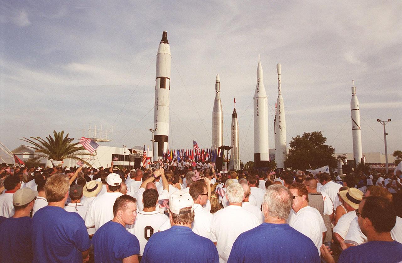  A crowd of police officers and their families cheer a presentation of flags during opening ceremonies of the 2000 International Law Enforcement Games. Held in the KSC Visitor Complex Rocket Garden, the ceremony hosted more than 1,850 participants and their families for events that included parades, torch lighting and a tug of war. The games feature officers from 15 countries and 37 United States in competitions around Brevard County, Fla