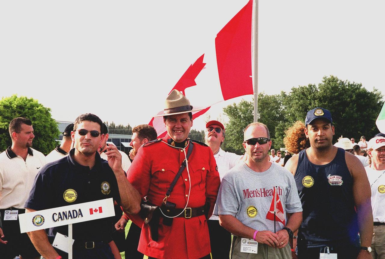 Canadian police officers gather in the KSC Visitor Complex Rocket Garden during opening ceremonies of the 2000 International Law Enforcement Games. More than 1,850 participants and their families took part in the opening, held in the Rocket Garden. The ceremony included parades, torch lighting and a tug of war. The games feature officers from 15 countries and 37 United States in competitions around Brevard County, Fla