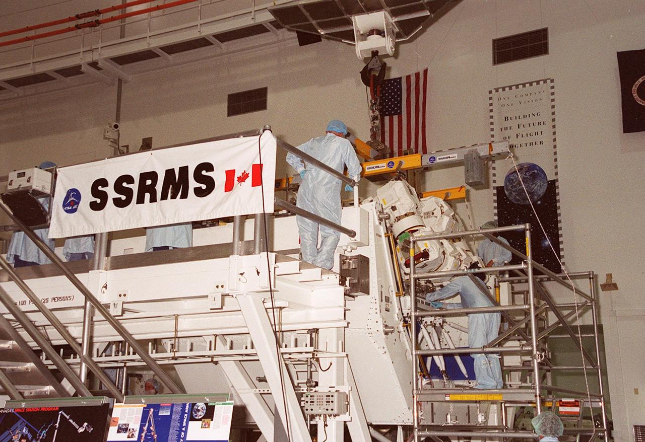 The Canadian Space Agency’s Space Station Remote Manipulator System (SSRMS) now occupies one of the work stands in the Space Station Processing Facility. There it will be mated to its payload carrier and later be installed into the payload bay of Space Shuttle Endeavour for launch to the International Space Station on STS-100 in April 2001. The 56-foot-long arm will be the primary means of transferring payloads between the orbiter payload bay and the Station. Its three segments comprise seven joints for highly flexible land precise movement, making it capable of moving around the Station’s exterior like an inchworm