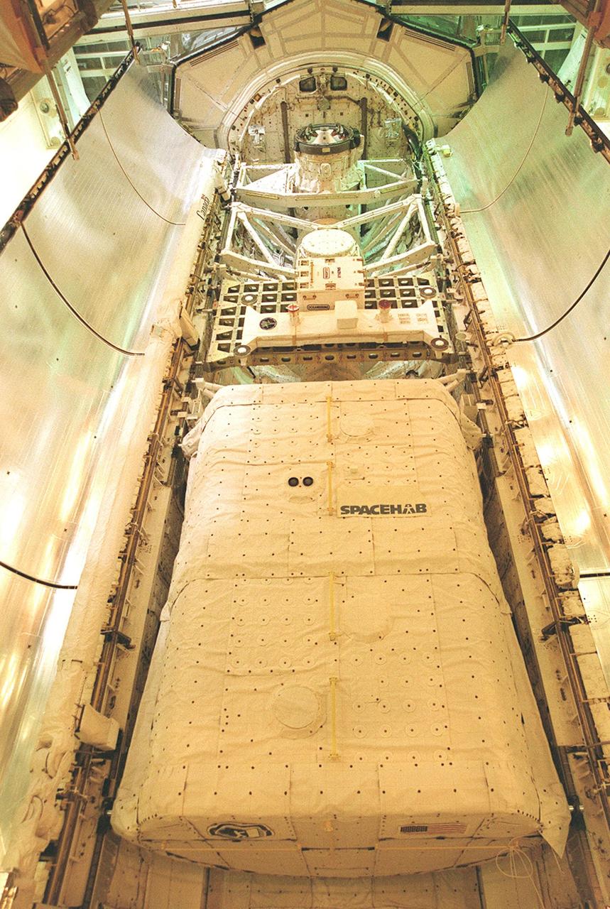 KENNEDY SPACE CENTER, FLA. -- The STS-106 payload within the SPACEHAB Module is shown after being loaded onto Atlantis on Launch Pad 39-B using the Payload Ground Handling Mechanism (PGHM). The PGHM (pronounced pigem) is located inside the Payload Changeout Room (PCR) of each shuttle launch pad’s Rotating Service Structure. The PGHM removes payloads from a transportation canister and installs them into the orbiter. It is essentially NASA’s largest fork-lift