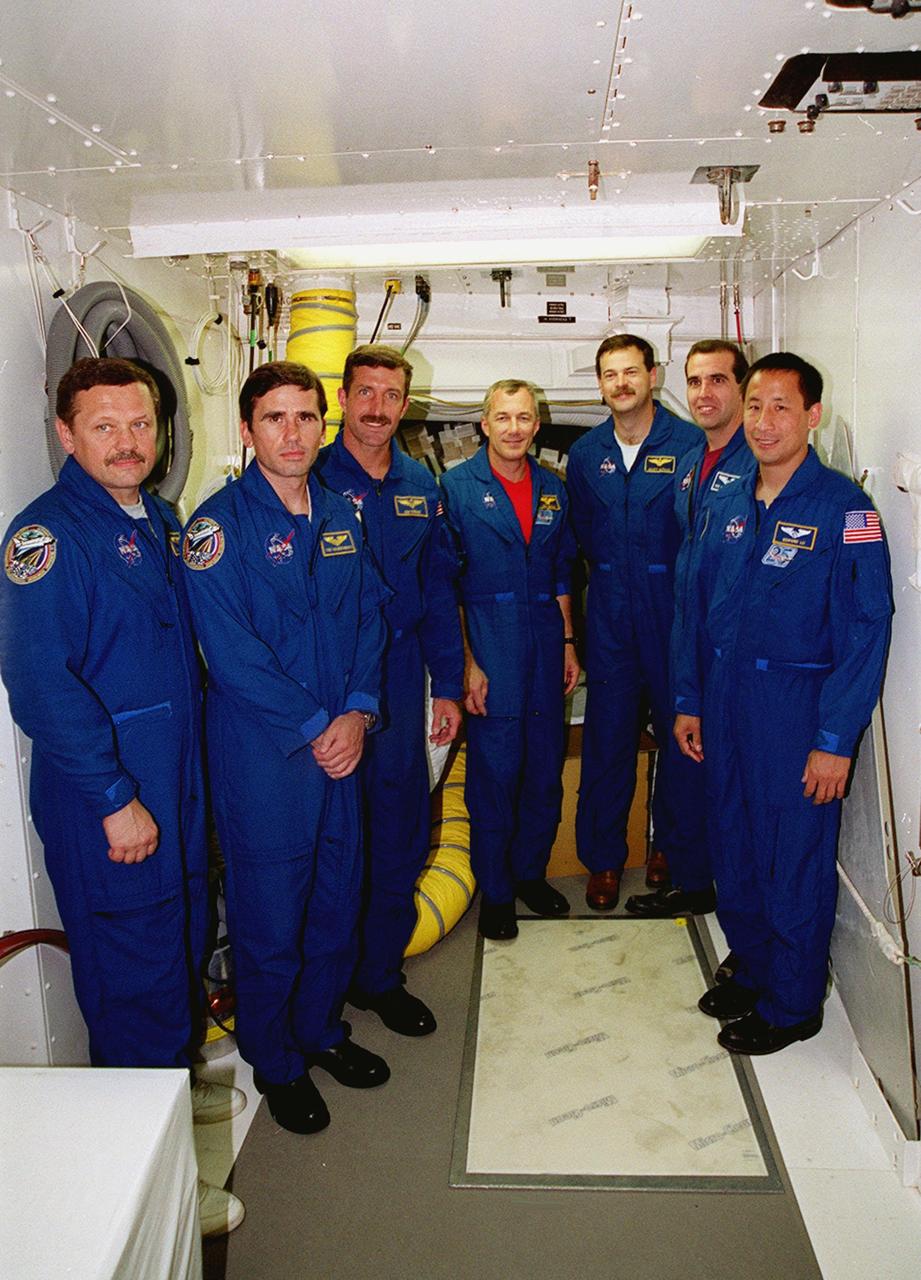 KENNEDY SPACE CENTER, Fla. -- The STS-106 flight crew gather in the white room of Launch Pad 39-B. Crew members pictured are, from left, Mission Specialists Boris V. Morukov, Yuri I. Malenchenko, Daniel C. Burbank, Commander Terrence W. Wilcutt, Pilot Scott D. Altman, Mission Specialists Richard A. Mastracchio and Edward T. Lu. Malenchenko and Morukov are with the Russian Aviation and Space Agency. The flight crew were at Kennedy Space Center to take part in Terminal Countdown Demonstration Test (TCDT) activities. The TCDT provides the crew with emergency egress training and opportunities to inspect their mission payload in the orbiter’s payload bay. STS-106 is scheduled to launch Sept. 8, 2000, at 8:31 a.m. EDT from Launch Pad 39B. On the 11-day mission, the seven-member crew will perform support tasks on orbit, transfer supplies and prepare the living quarters in the newly arrived Zvezda Service Module. The first long-duration crew, dubbed “Expedition One,” is due to arrive at the Station in late fall