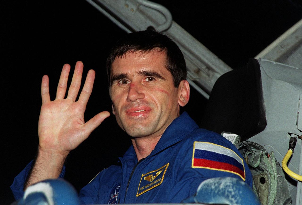STS-106 Mission Specialist Yuri I. Malenchenko waves for the camera as he arrives at the KSC Shuttle Landing Facility. Malenchenko is with the Russian Aviation and Space Agency. He and the rest of the crew will be making pre-launch preparations for the fourth flight to the International Space Station. STS-106 is scheduled to launch Sept. 8, 2000, at 8:45 a.m. EDT from Launch Pad 39B. On the 11-day mission, the seven-member crew will perform support tasks on orbit, transfer supplies and prepare the living quarters in the newly arrived Zvezda Service Module. The first long-duration crew, dubbed "Expedition One," is due to arrive at the Station in late fall