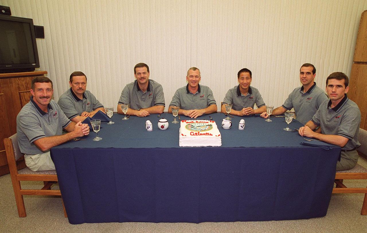 The STS-106 crew relax after breakfast and before suitup for launch. Seated (left to right) are Mission Specialists Daniel C. Burbank and Boris V. Morukov; Pilot Scott D. Altman; Commander Terrence W. Wilcutt; and Mission Specialists Edward T. Lu, Richard A. Mastracchio and Yuri I. Malenchenko. Morukov and Malenchenko are with the Russian Aviation and Space Agency. Launch of Space Shuttle Atlantis is set for 8:45 a.m. EDT on the fourth flight to the International Space Station. On the 11-day mission, the seven-member crew will perform support tasks on orbit, transfer supplies and prepare the living quarters in the newly arrived Zvezda Service Module. The first long-duration crew, dubbed “Expedition One,” is due to arrive at the Station in late fall