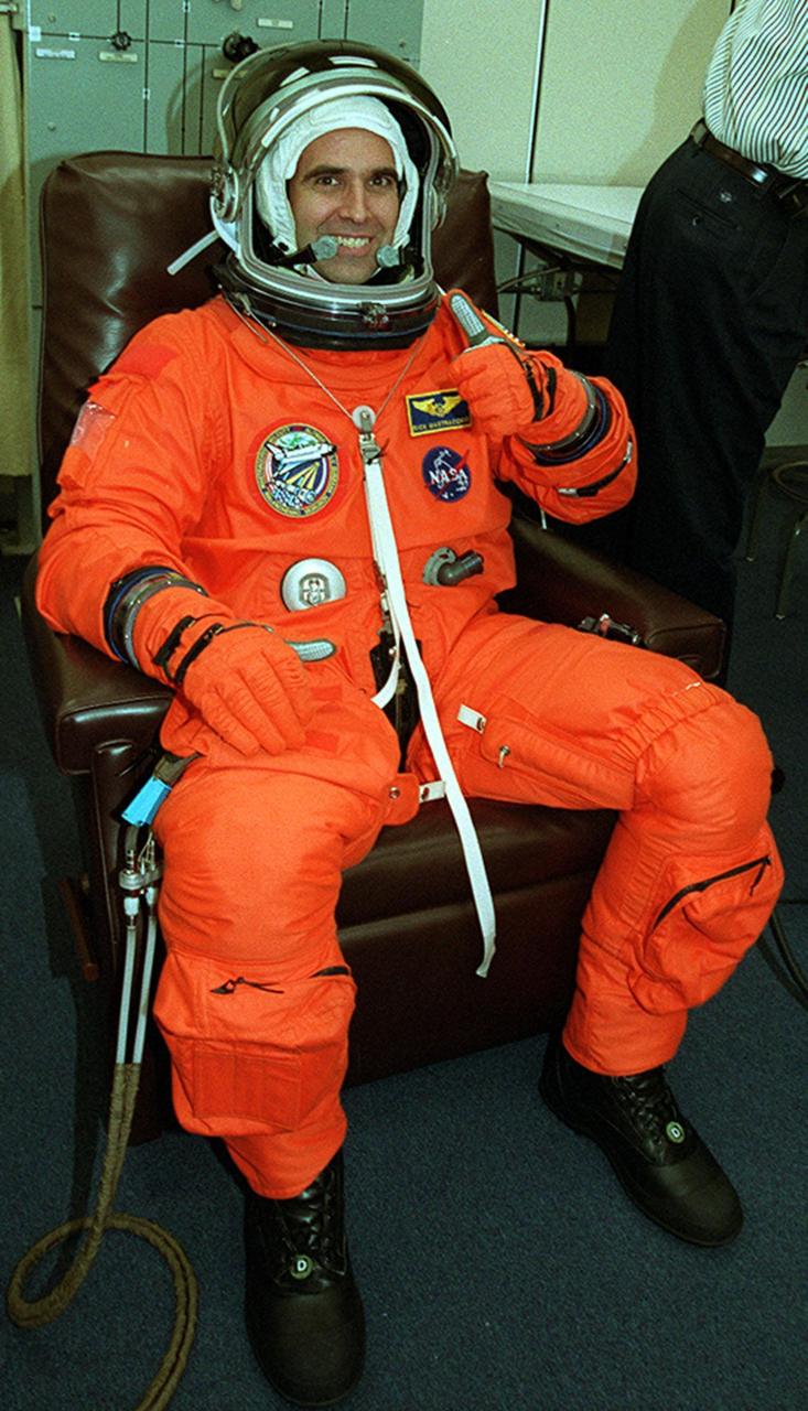 Already suited up, Mission Specialist Richard A. Mastracchio gives thumbs up for launch today. This is Mastracchio’s first space flight. Space Shuttle Atlantis is set to lift off 8:45 a.m. EDT on the fourth flight to the International Space Station. During the 11-day mission, the seven-member crew will perform support tasks on orbit, transfer supplies and prepare the living quarters in the newly arrived Zvezda Service Module. The first long-duration crew, dubbed “Expedition One,” is due to arrive at the Station in late fall