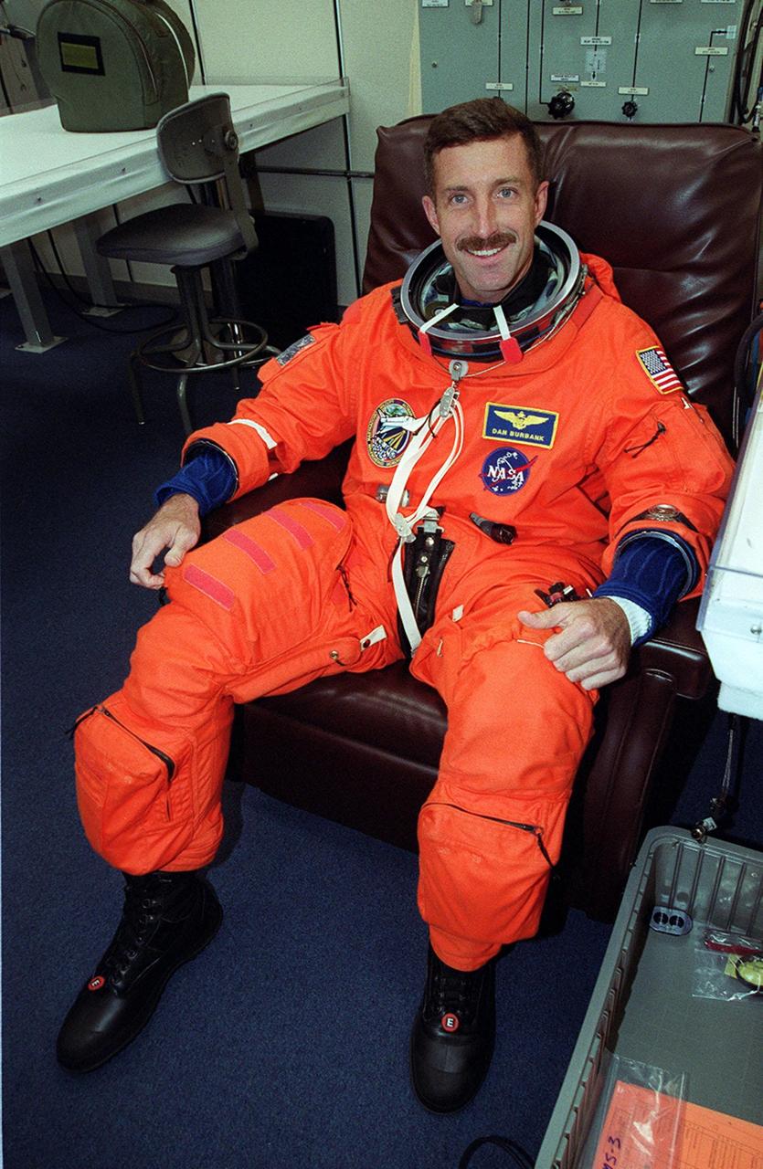 During suitup in the Operations and Checkout Building, STS-106 Mission Specialist Daniel C. Burbank smiles in anticipation of launch. This is Burbank’s first space flight. Space Shuttle Atlantis is set to lift off 8:45 a.m. EDT on the fourth flight to the International Space Station. During the 11-day mission, the seven-member crew will perform support tasks on orbit, transfer supplies and prepare the living quarters in the newly arrived Zvezda Service Module. The first long-duration crew, dubbed “Expedition One,” is due to arrive at the Station in late fall