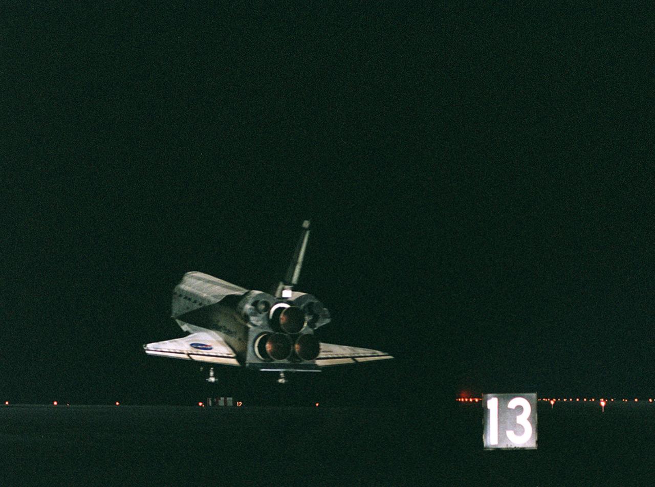 KENNEDY SPACE CENTER, Fla. -- The orbiter Atlantis nears touchdown on Runway 15 of the KSC Shuttle Landing Facility. Atlantis and crew traveled 4.9 million miles on the 11-day, 19-hour, 11-minute mission STS-106. Main gear touchdown occurred on-time at 3:56:48 a.m. EDT. During the mission to the International Space Station, the crew transferred nearly 5,000 pounds of equipment and supplies for use by the first resident crew expected to arrive in November. STS-106 was the 99th flight in the Shuttle program and the 22nd for Atlantis. STS-106 also marked the 15th nighttime landing in Shuttle history and the 23rd consecutive landing at KSC