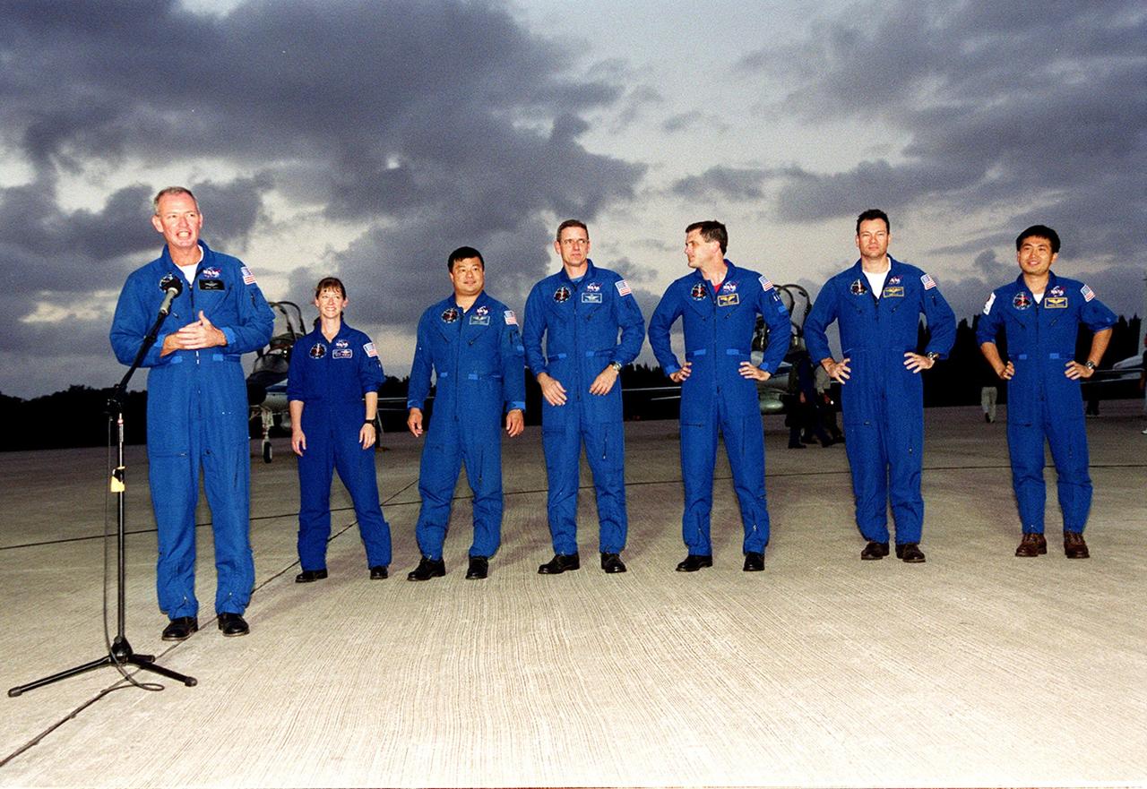 KENNEDY SPACE CENTER, FLA. -- After their arrival at KSC’s Shuttle Landing Facility, the STS-92 crew paused to talk to the media, who were waiting nearby. At the microphone is Commander Brian Duffy. Standing behind him, left to right, are Pilot Pamela Ann Melroy and Mission Specialists Leroy Chiao, William S. McArthur Jr., Peter J.K. “Jeff” Wisoff, Michael E. Lopez-Alegria and Koichi Wakata of Japan. The mission is the fifth flight for the construction of the International Space Station. The payload includes the Integrated Truss Structure Z-1 and the third Pressurized Mating Adapter. During the 11-day mission, four extravehicular activities (EVAs), or space walks, are planned