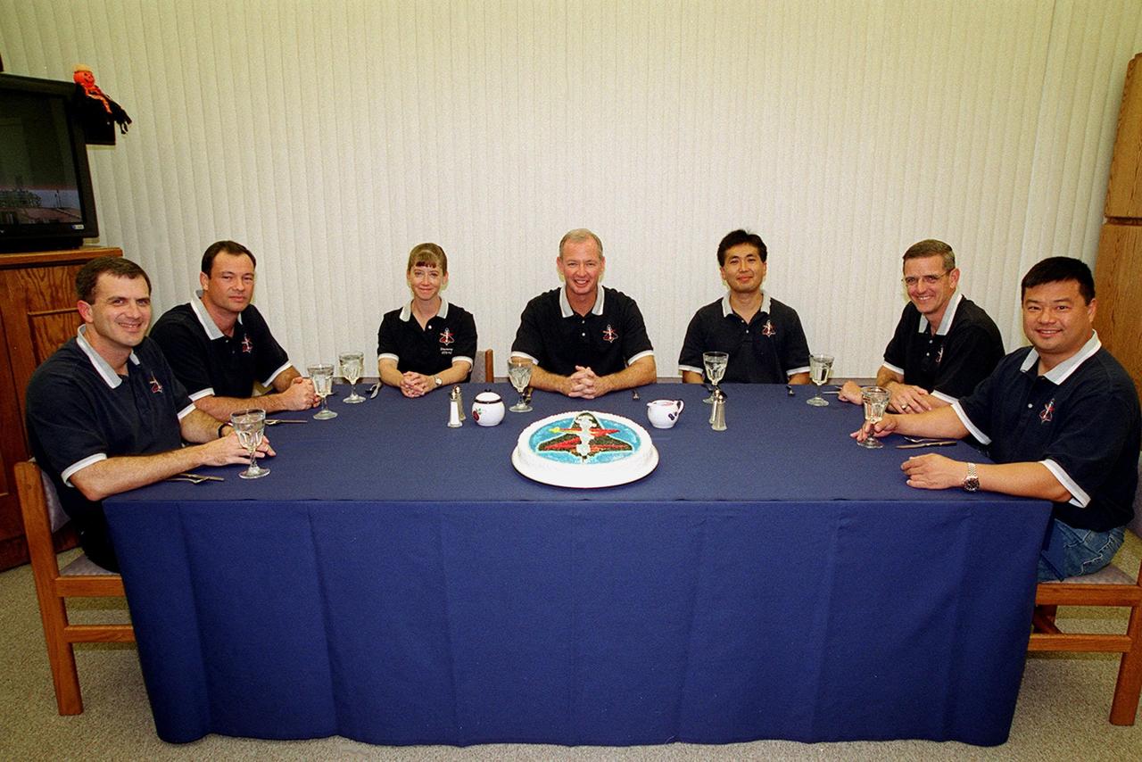 The STS-92 crew pose for a group photo after a snack prior to suiting up for launch. Seated left to right are Mission Specialists Peter J.K. “Jeff” Wisoff and Michael E. Lopez-Alegria; Pilot Pamela Ann Melory; Commander Brian Duffy; and Mission Specialists Koichi Wakata of Japan, William S. McArthur Jr. and Leroy Chiao. The mission is the fifth flight for the construction of the ISS. The payload includes the Integrated Truss Structure Z-1 and the third Pressurized Mating Adapter. During the 11-day mission, four extravehicular activities (EVAs), or spacewalks, are planned. The Z-1 truss is the first of 10 that will become the backbone of the International Space Station, eventually stretching the length of a football field. PMA-3 will provide a Shuttle docking port for solar array installation on the sixth ISS flight and Lab installation on the seventh ISS flight. This launch is the fourth for Duffy and Wisoff, the third for Chiao and McArthur, second for Wakata and Lopez-Alegria, and first for Melroy. Launch is scheduled for 8:05 p.m. EDT. Landing is expected Oct. 21 at 3:55 p.m. EDT