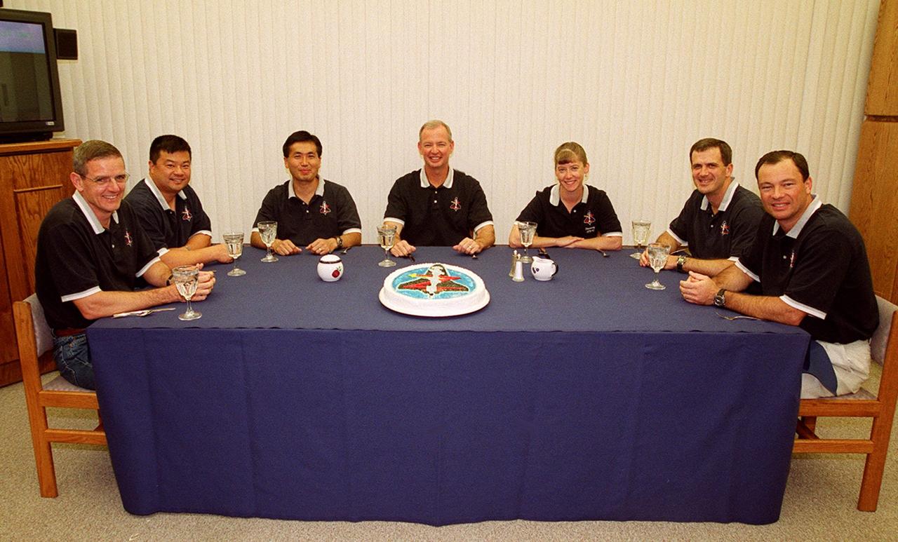 The STS-92 crew begin their journey to Launch Pad 39A with a snack. Seated at the table (left to right) are Mission Specialists William S. McArthur Jr., Leroy Chiao and Koichi Wakata of Japan; Commander Brian Duffy; Pilot Pamela Ann Melroy; and Mission Specialists Peter J.K. “Jeff” Wisoff and Michael E. Lopez-Alegria. During the 11-day mission to the International Space Station, four extravehicular activities (EVAs), or spacewalks, are planned for construction. The payload includes the Integrated Truss Structure Z-1 and the third Pressurized Mating Adapter. The Z-1 truss is the first of 10 that will become the backbone of the Space Station, eventually stretching the length of a football field. PMA-3 will provide a Shuttle docking port for solar array installation on the sixth Station flight and Lab installation on the seventh Station flight. This launch is the fourth for Duffy and Wisoff, the third for Chiao and McArthur, second for Wakata and Lopez-Alegria, and first for Melroy. Launch is scheduled for 7:17 p.m. EDT. Landing is expected Oct. 22 at 2:10 p.m. EDT