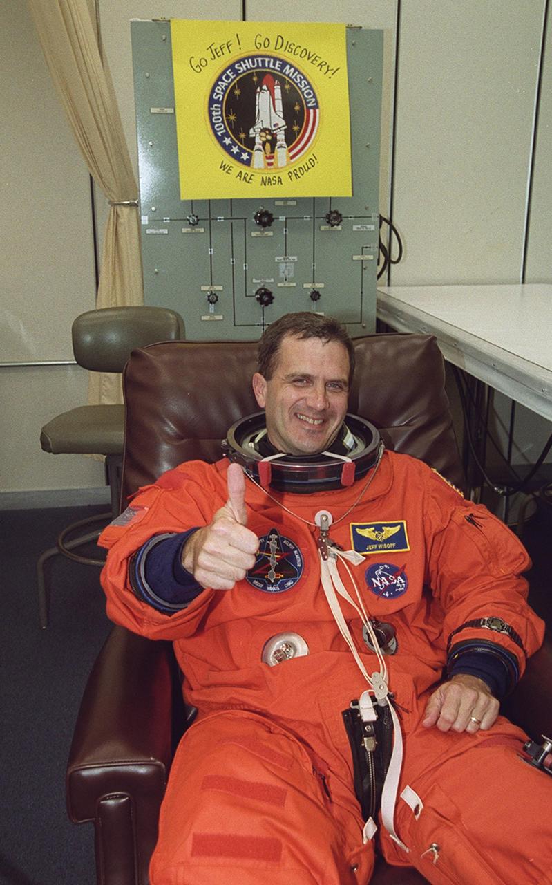 During suitup in the Operations and Checkout Building, STS-92 Mission Specialist Peter J.K. “Jeff” Wisoff signals thumbs up for a second launch attempt. During the 11-day mission to the International Space Station, four extravehicular activities (EVAs), or spacewalks, are planned for construction. The payload includes the Integrated Truss Structure Z-1 and the third Pressurized Mating Adapter. The Z-1 truss is the first of 10 that will become the backbone of the Space Station, eventually stretching the length of a football field. PMA-3 will provide a Shuttle docking port for solar array installation on the sixth Station flight and Lab installation on the seventh Station flight. Launch is scheduled for 7:17 p.m. EDT. Landing is expected Oct. 22 at 2:10 p.m. EDT