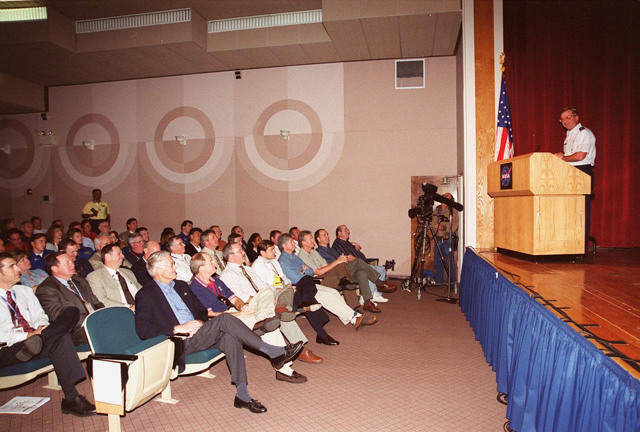 In the Training Auditorium at KSC, Brig. General Donald P. Pettit, commander of the 45th Space Wing, speaks to attendees at a presentation for Super Safety and Health Day. Safety Day is a full day of NASA-sponsored, KSC and 45th Space Wing events involving a number of health and safety related activities: Displays, vendors, technical paper sessions, panel discussions, a keynote speaker, etc. The entire Center and Wing stand down to participate in the planned events. Safety Day is held annually to proactively increase awareness in safety and health among the government and contractor workforce population. The first guiding principle at KSC is “Safety and Health First.” KSC’s number one goal is to “Assure sound, safe and efficient practices and processes are in place for privatized/commercialized launch site processing.
