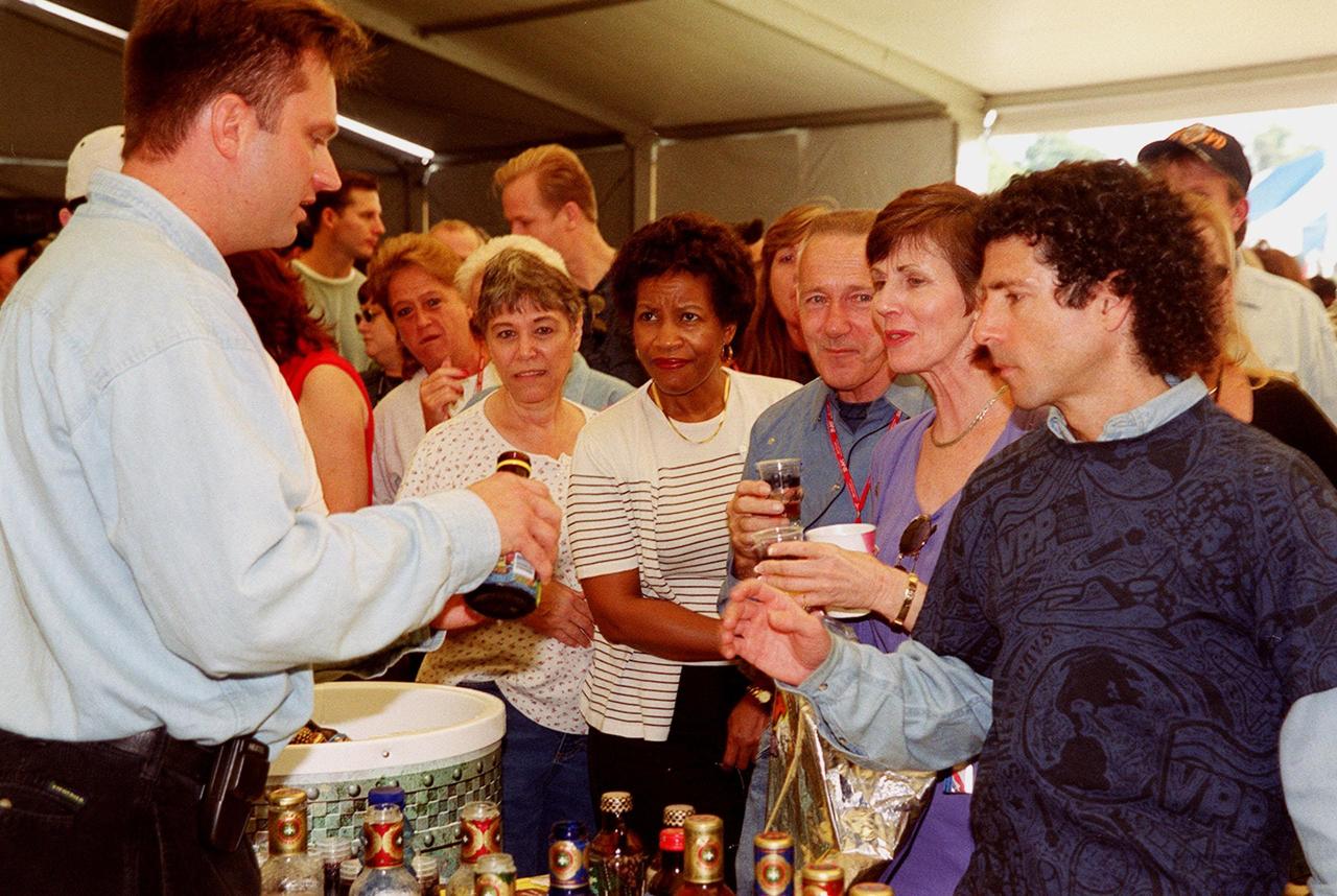 In an exhibit tent during Super Safety and Health Day at KSC, employees sample iced tea from a vendor. Safety Day is a full day of NASA-sponsored, KSC and 45th Space Wing events involving a number of healthand safety-related activities: Displays, vendors, technical paper sessions, panel discussions, a keynote speaker, etc. The entire Center and Wing stand down to participate in the planned events. Safety Day is held annually to proactively increase awareness in safety and health among the government and contractor workforce population. The first guiding principle at KSC is “Safety and Health First.” KSC’s number one goal is to “Assure sound, safe and efficient practices and processes are in place for privatized/commercialized launch site processing.
