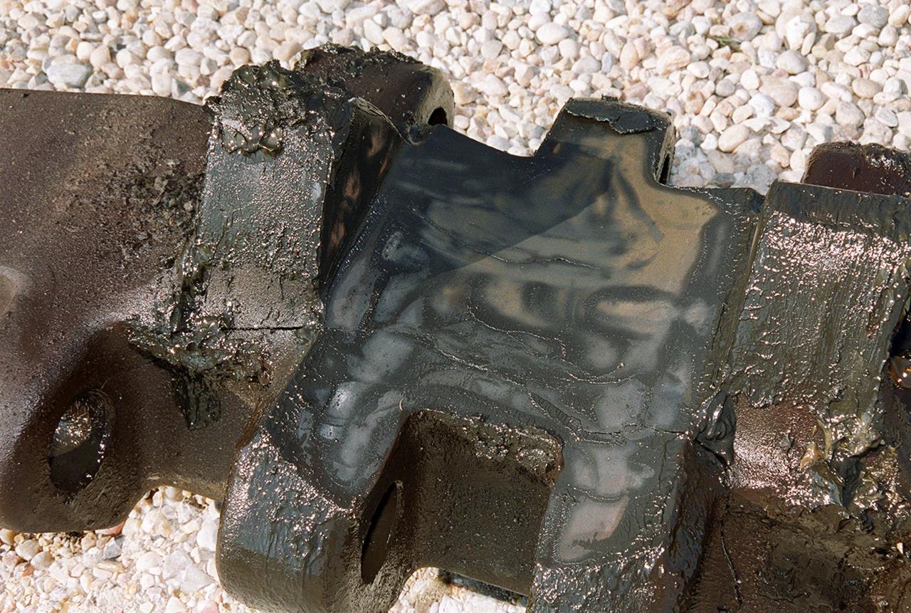 The crack in the crawler-transporter cleat that delayed rollout of Space Shuttle Endeavour can be seen as a white dotted line on the top-center and running down the right side. The cleat rests on the ground near Launch Pad 39B. The cracked cleat forced the reverse of the rollout back outside the pad gate so the cleat could be replaced on flat ground before moving up the incline to the top of the pad. Endeavour is scheduled to be launched Nov. 30 at 10:01 p.m. EST on mission STS-97, the sixth construction flight to the International Space Station. Its payload includes the P6 Integrated Truss Structure and a photovoltaic (PV) module, with giant solar arrays that will provide power to the Station. The mission includes two spacewalks to complete the solar array connections
