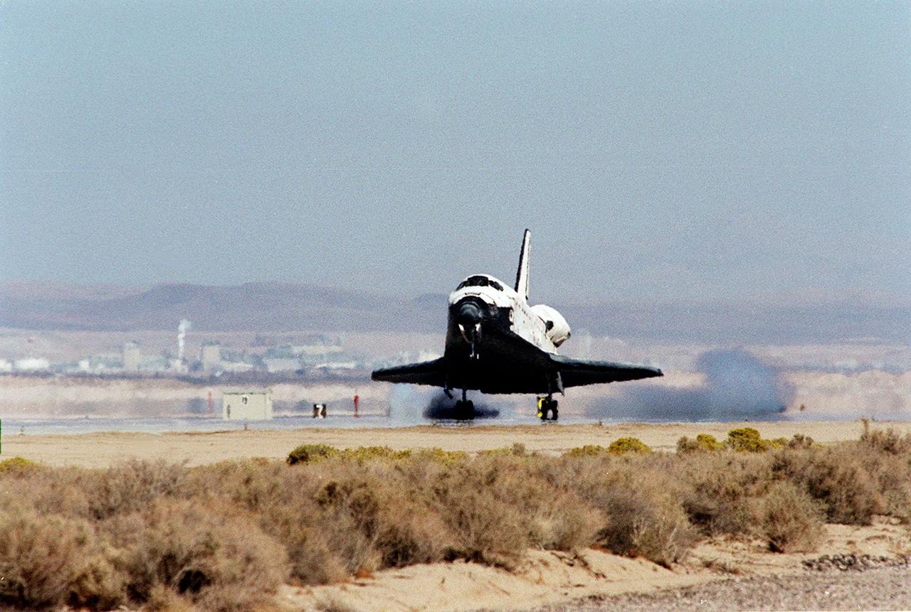 Orbiter Discovery, with its seven-member crew, touches down on the landing strip at Edwards Air Force Base, Calif., after an 11-day mission to the International Space Station. The orbiter’s main landing gear touched down on EAFB runway 22 at 5 p.m. With the aid of its drag chute, Discovery came to a complete stop at 5:01 p.m. At the conclusion of mission STS-92, Discovery and crew had traveled about 5.3 million statute miles. Following vehicle safing and preliminary offloading efforts, workers will begin preparations for Discovery’s transcontinental ferry flight back to KSC on the back of NASA’s modified Boeing 747