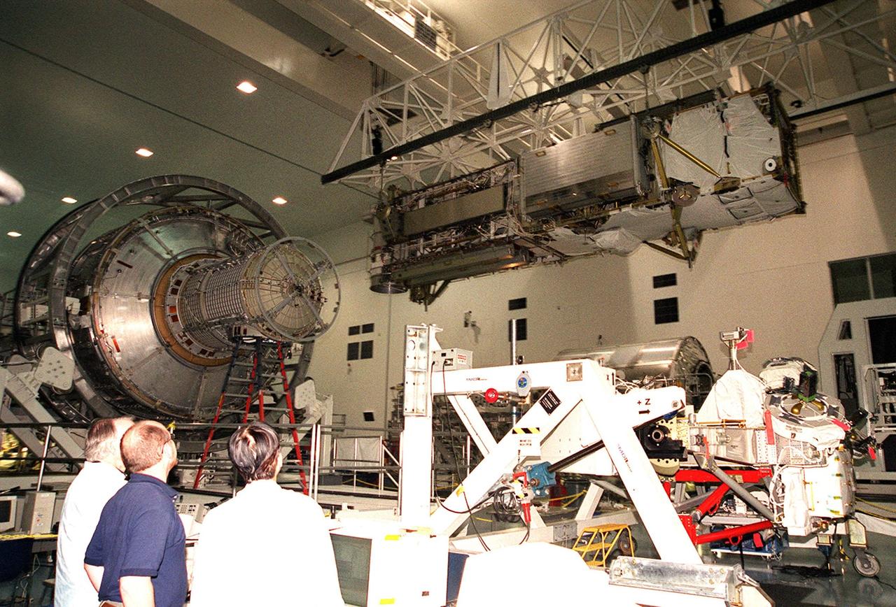 In the Space Station Processing Facility, the P6 integrated truss segment travels across the building to a payload transport canister for transfer to Launch Pad 39B. There it will be placed in Endeavour’s payload bay for launch on mission STS-97. At left is the airlock module, another component of the International Space Station. The P6 comprises Solar Array Wing-3 and the Integrated Electronic Assembly, to be installed on the Space Station. The Station’s electrical power system will use eight photovoltaic solar arrays, each 112 feet long by 39 feet wide, to convert sunlight to electricity. The solar arrays are mounted on a “blanket” that can be folded like an accordion for delivery. Once in orbit, astronauts will deploy the blankets to their full size. Gimbals will be used to rotate the arrays so that they will face the Sun to provide maximum power to the Space Station. Launch is scheduled Nov. 30 at 10:06 p.m. EST