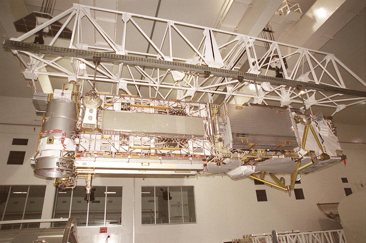 The P6 integrated truss segment hangs suspended from an overhead crane that is moving it the length of the Space Station Processing Facility toward a payload transport canister for transfer to Launch Pad 39B. At the pad, the Space Station element will be placed in Endeavour’s payload bay for launch on mission STS-97. The P6 comprises Solar Array Wing-3 and the Integrated Electronic Assembly, to be installed on the Space Station. The Station’s electrical power system will use eight photovoltaic solar arrays, each 112 feet long by 39 feet wide, to convert sunlight to electricity. The solar arrays are mounted on a “blanket” that can be folded like an accordion for delivery. Once in orbit, astronauts will deploy the blankets to their full size. Gimbals will be used to rotate the arrays so that they will face the Sun to provide maximum power to the Space Station. The STS-97 launch is scheduled Nov. 30 at 10:06 p.m. EST