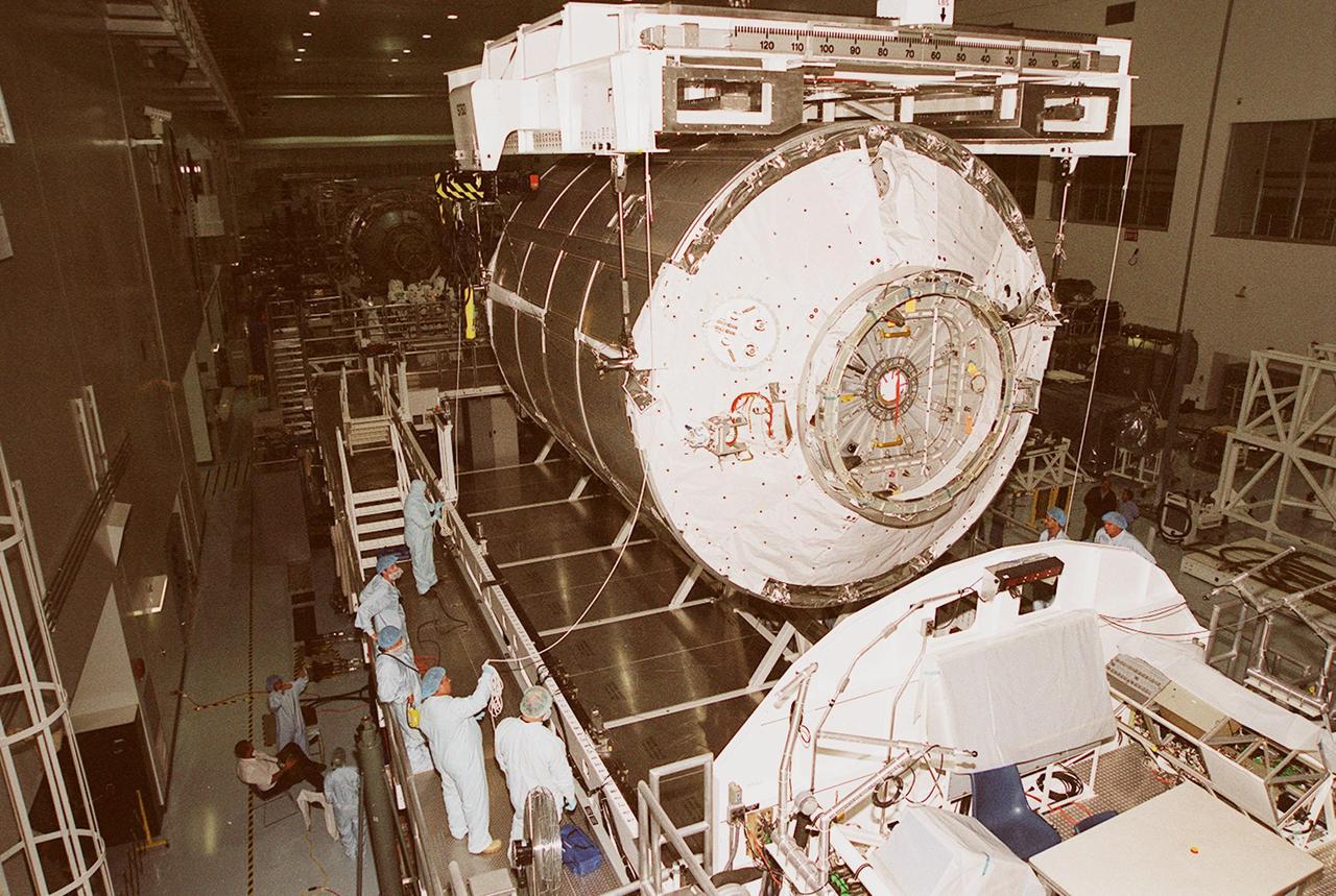 In the Space Station Processing Facility, the Italian-built Multi-Purpose Logistics Module “Raffaello” is lowered onto a workstand where its weight and balance will be evaluated. Rafaello is the payload on mission STS-100, a Lab outfitting flight. Raffaello carries six system racks and two storage racks for the U.S. Lab. Launch of STS-100 is scheduled for April 19, 2001