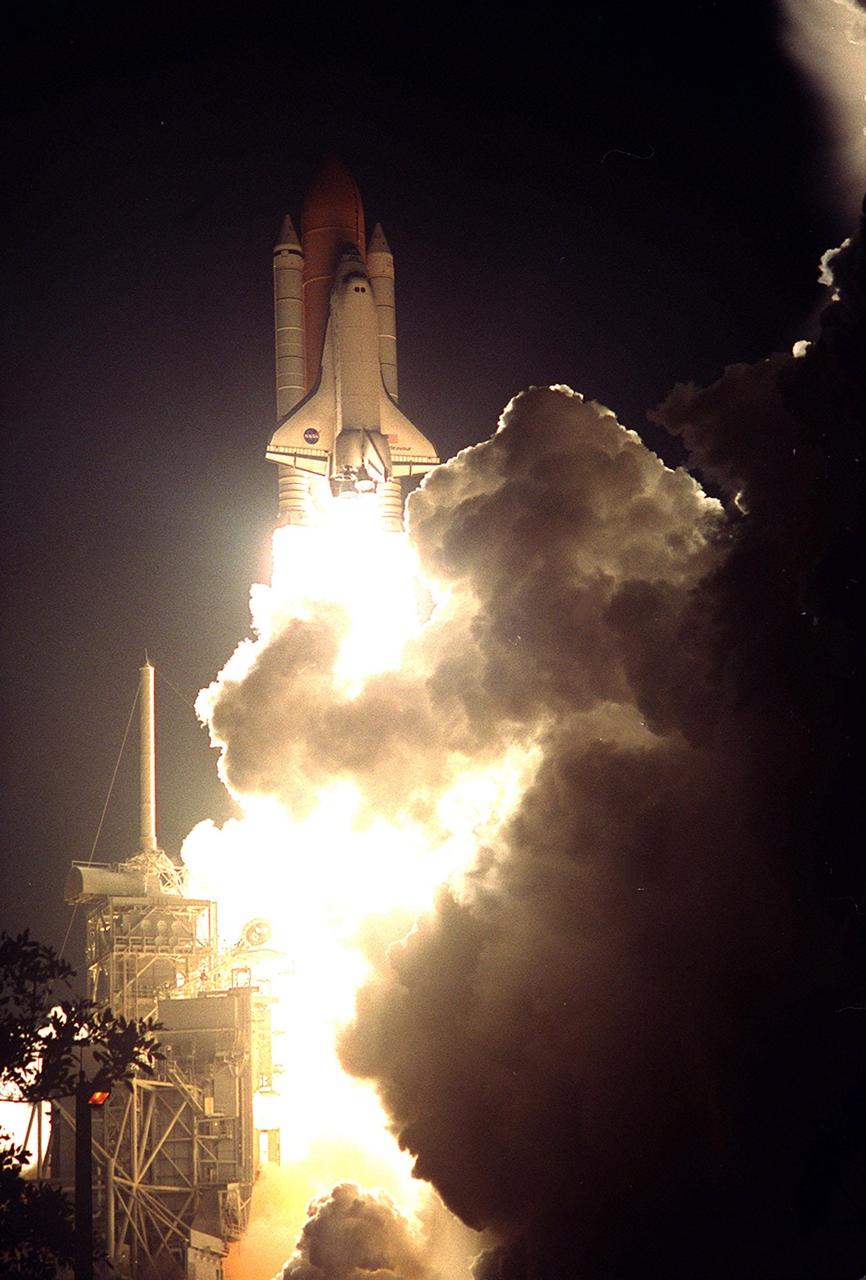 KENNEDY SPACE CENTER, Fla.  --  In a perfect, on-time launch, Space Shuttle Endeavour breaks away from the billows of smoke and steam around Launch Pad 39B. Liftoff of Endeavour occurred at 10:06:01 p.m. EST on mission STS-97. Endeavour and its five-member crew will deliver U.S. solar arrays to the International Space Station and be the first Shuttle crew to visit the Station’s first resident crew. The 11-day mission includes three spacewalks. This marks the 101st mission in Space Shuttle history and the 25th night launch. Endeavour is expected to land Dec. 11 at 6:19 p.m. EST
