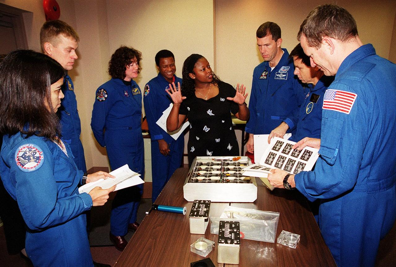 KENNEDY SPACE CENTER, FLA. -- As part of In-Flight Maintenance training at SPACEHAB, in Cape Canaveral, Fla., members of the STS-107 crew learn about Biological Research in Canisters (BRIC) experiments that will be on their mission. From left are Mission Specialist Kalpana Chawla, Pilot William C. “Willie” McCool, Mission Specialists Laurel Clark and Michael Anderson, Roberteen McCray of Bionetics, Commander Rick D. Husband,; Payload Specialist Ilan Ramon of Israel and Mission Specialist David M. Brown. STS-107 will carry a broad collection of experiments ranging from material science to life science. It is scheduled to launch July 19, 2001