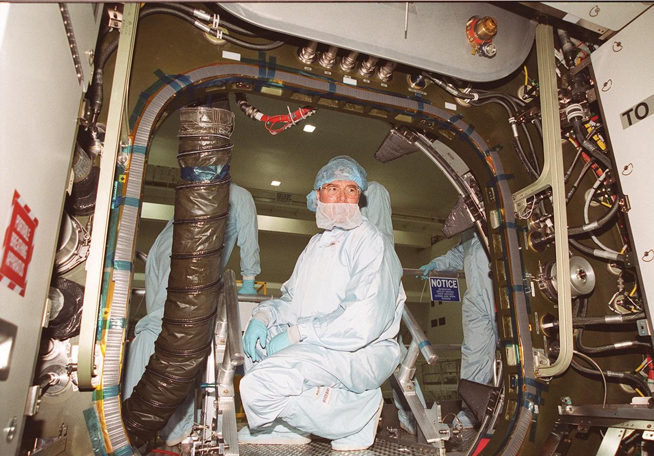 KENNEDY SPACE CENTER, FLA. --  Steve Thomas, host of the television series "This Old House," gets a look inside one of the Space Station modules in the Space Station Processing Facility. He and the show's master carpenter Norm Abram are at KSC to film an episode of the series