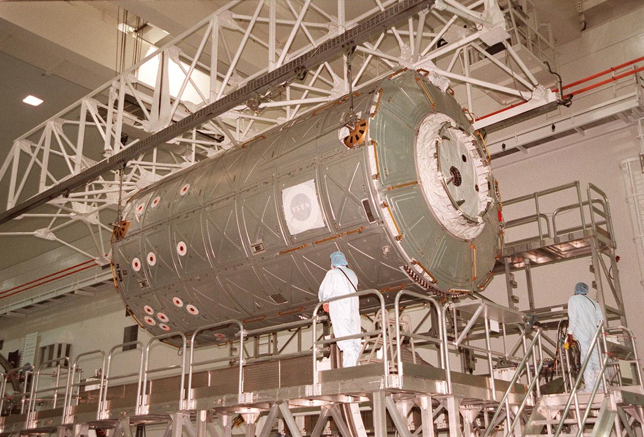 KENNEDY SPACE CENTER, FLA. --  In the Space Station Processing Facility, an overhead crane begins lifting the U.S. Lab Destiny from its test and integration stand. It will be carried to the Launch Package Integration Stand (LPIS) for a weight and center of gravity determination. Destiny is the payload aboard Space Shuttle Atlantis on mission STS-98 to the International Space Station. The lab is fitted with five system racks and will already have experiments installed inside for the flight. The launch is scheduled for January 2001