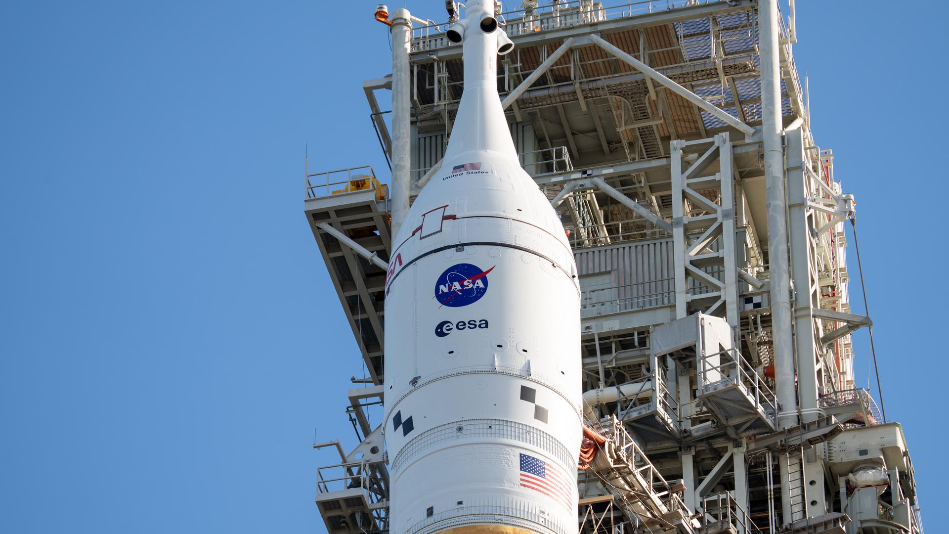 This image shows NASA’s SLS (Space Launch System) and Orion spacecraft rolling out of the Vehicle Assembly Building at NASA’s Kennedy Space Center. NASA's massive Crawler-Transporter, upgraded for the Artemis program, carries the powerful SLS rocket and Orion spacecraft on the Mobile Launcher from the Vehicle Assembly Building to Launch Pad 39B at Kennedy Space Center in preparation for the Artemis II mission.