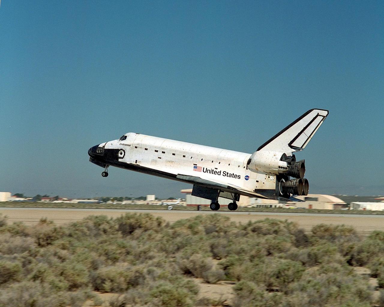 NASA/EDWARDS AFB, CALIF. -- Endeavour’s rear wheels touch down on runway 22 at Edwards Air Force Base, Calif., after the 11-day, 12-hour, 54-minute mission STS-100 to the International Space Station. Landing time was 12:10:42 p.m. EDT. The orbiter and its crew of seven logged about 4.9 million statute miles in 186 orbits. Due to unfavorable weather conditions, landing at KSC was waved off. The landing marked the third consecutive landing at EAFB.