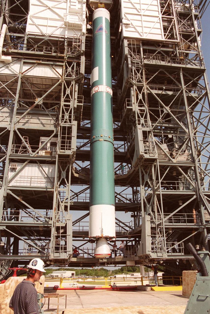 KENNEDY SPACE CENTER, FLA. -- On Launch Complex 17-B, Cape Canaveral Air Force Station, the first stage of a Boeing Delta rocket is suspended in the gantry on the pad. When fully assembled, the rocket is scheduled to launch the MAP instrument June 30 into a lunar-assisted trajectory to the Sun-Earth for a 27-month mission. MAP will measure small fluctuations in the temperature of the cosmic microwave background radiation to an accuracy of one millionth of a degree. These measurements should reveal the size, matter content, age, geometry and fate of the universe. They will also reveal the primordial structure that grew to form galaxies and will test ideas about the origins of these primordial structures. The MAP instrument will be continuously shaded from the Sun, Earth, and Moon by the spacecraft. It is a product of Goddard Space Flight Center in partnership with Princeton University