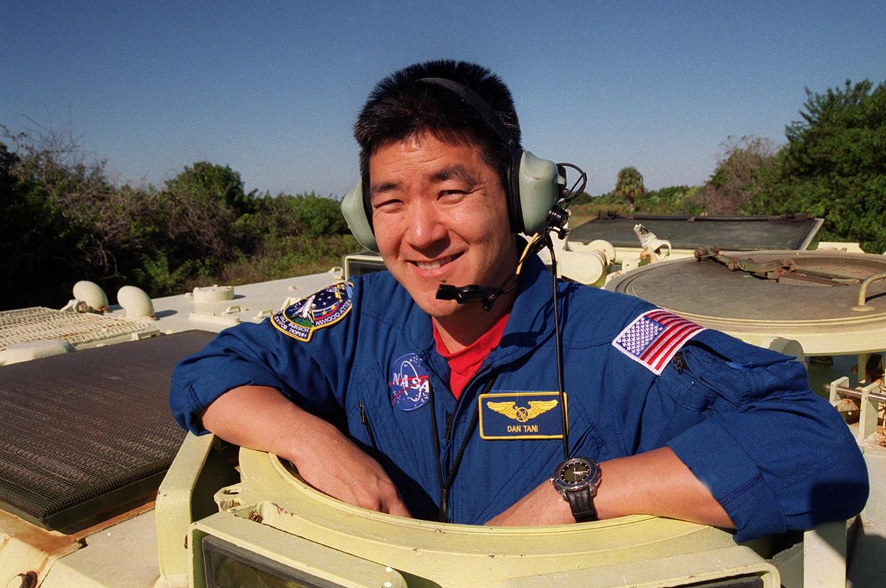 KENNEDY SPACE CENTER, Fla. --  STS-108 Mission Specialist Daniel M. Tani is ready to practice driving an M-113 armored personnel carrier.  He and other crew members are taking part in Terminal Countdown Demonstration Test activities, which include emergency exit from the launch pad and a simulated launch countdown.   STS-108 is a Utilization Flight that will carry the replacement Expedition 4 crew to the International Space Station, as well as the Multi-Purpose Logistics Module Raffaello, filled with supplies and equipment.  The l1-day mission is scheduled for launch Nov. 29 on Space Shuttle Endeavour