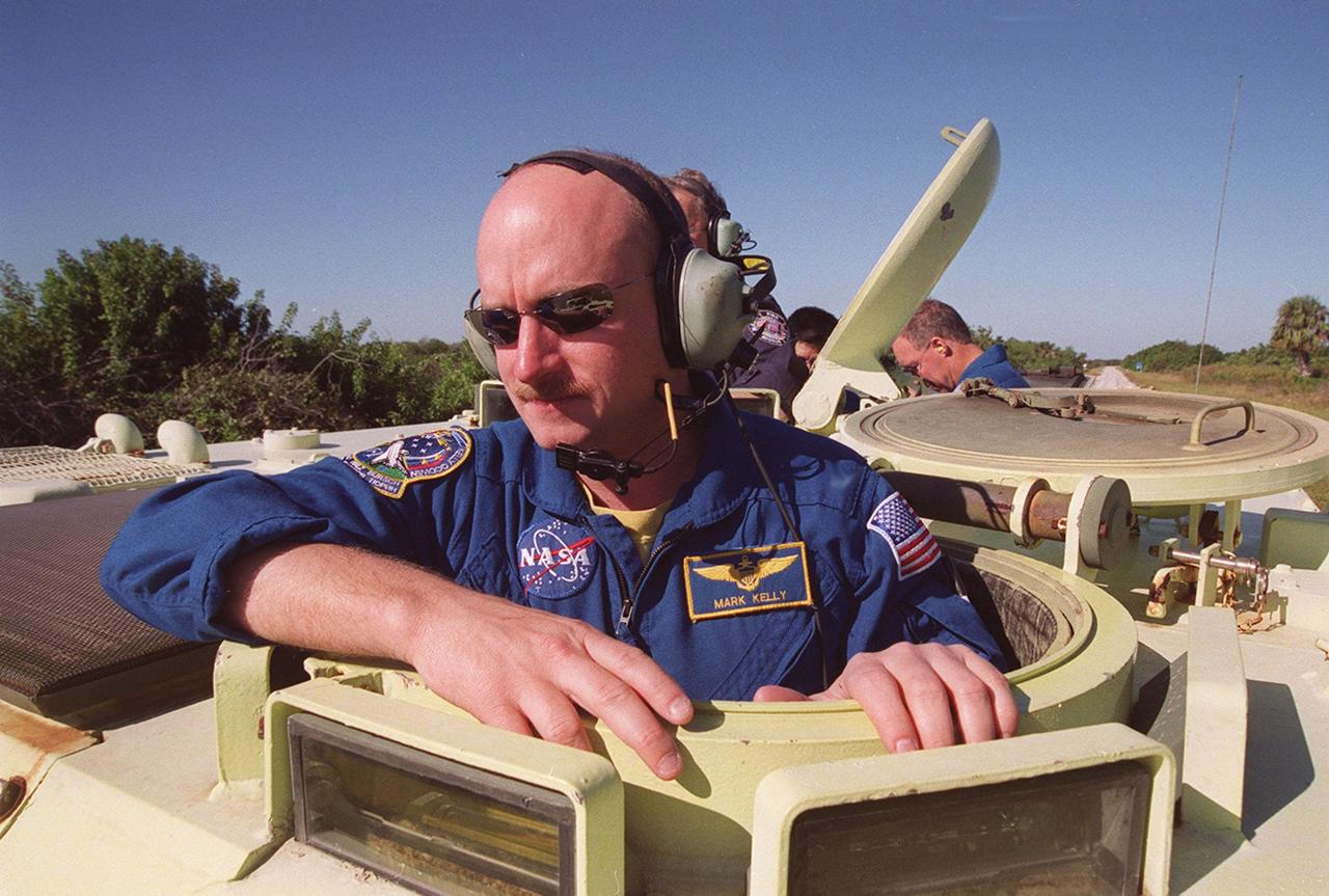 KENNEDY SPACE CENTER, Fla. --  STS-108 Pilot Mark E. Kelly is ready to practice driving an M-113 armored personnel carrier.  He and other crew members are taking part in Terminal Countdown Demonstration Test activities, which include emergency exit from the launch pad and a simulated launch countdown. STS-108 is a Utilization Flight that will carry the replacement Expedition 4 crew to the International Space Station, as well as the Multi-Purpose Logistics Module Raffaello, filled with supplies and equipment.  The l1-day mission is scheduled for launch Nov. 29 on Space Shuttle Endeavour