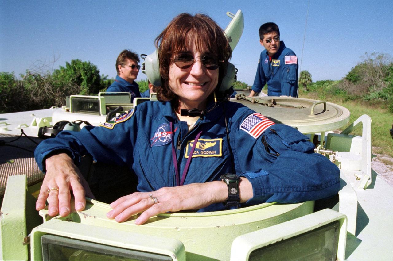 KENNEDY SPACE CENTER, Fla. --  STS-108 Mission Specialist Linda A. Godwin is ready to take her turn driving an M-113 armored personnel carrier.  She and other crew members are taking part in Terminal Countdown Demonstration Test activities, which include emergency exit from the launch pad and a simulated launch countdown. The 11-day mission will carry the replacement Expedition 4 crew to the International Space Station, as well as the Multi-Purpose Logistics Module Raffaello, filled with supplies and equipment.  STS-108 is scheduled to launch Nov. 29 on Space Shuttle Endeavour