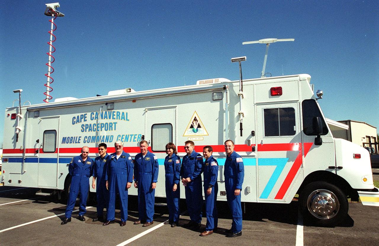 KENNEDY SPACE CENTER, Fla. --   STS-108 crew visit the Mobile Command Center at Cape Canaveral Air Force Station.  From left are Pilot Mark E. Kelly, Mission Specialist Daniel M. Tani, NASA helicopter pilot Dave Horton, Commander Dominic L. Gorie and Mission Specialist Linda A. Godwin; and Expedition 4 Commander Yuri Onufrienko, Daniel W. Bursch and Carl E. Walz.  Crew members are at KSC for Terminal Countdown Demonstration Test activities that include a simulated launch countdown, and emergency exit training from the orbiter and launch pad. STS-108 is a Utilization Flight that will carry the replacement Expedition 4 crew to the International Space Station, as well as the Multi-Purpose Logistics Module Raffaello, filled with supplies and equipment.  The 11-day mission is scheduled for launch Nov. 29 on Space Shuttle Endeavou