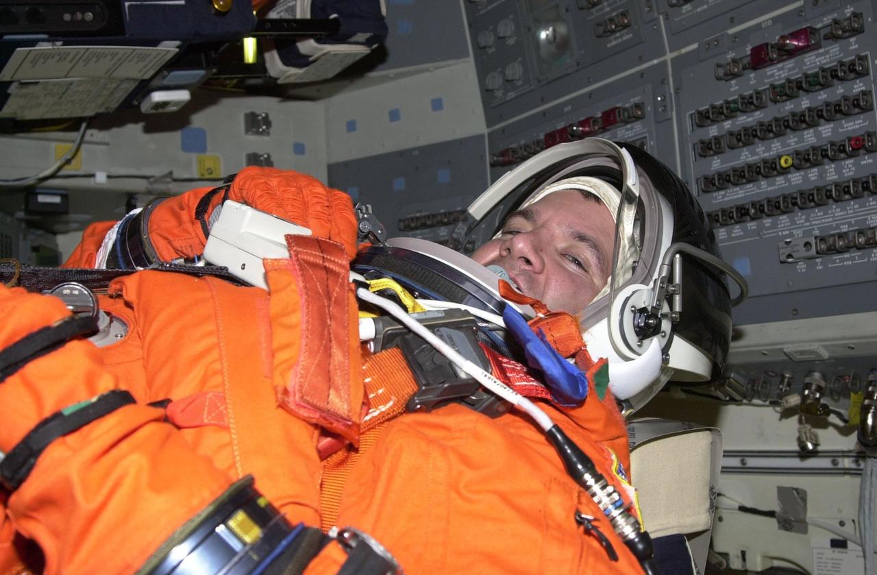 STS-102 Mission Specialist Paul Richards occupies seat 4 in orbiter Discovery, getting ready for a simulated countdown. He and the rest of the crew are taking part in Terminal Countdown Demonstration Test activities. STS-102 is the eighth construction flight to the Space Station, with Space Shuttle Discovery carrying the Multi-Purpose Logistics Module Leonardo. Launch on mission STS-102 is scheduled for March 8