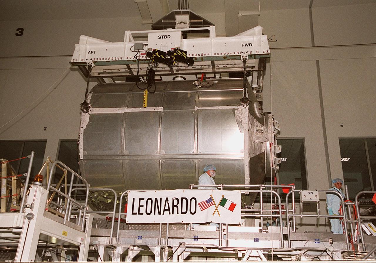 The Multi-Purpose Logistics Module Leonardo is lifted from its stand in the Space Station Processing Facility to move it to the weight and balance scale. The Italian-built MPLM is one of three such pressurized modules that will serve as the International Space Station's "moving vans," carrying laboratory racks filled with equipment, experiments and supplies to and from the station aboard the Space Shuttle. The cylindrical module is approximately 21 feet long and 15 feet in diameter, weighing almost 4.1 metric tons. It can carry up to 9.1 metric tons of cargo packed into 16 standard space station equipment racks. The Leonardo will be launched on mission STS-102 March 8. On that flight, Leonardo will be filled with equipment and supplies to outfit the U.S. laboratory module, to be carried to the ISS on the Feb. 7 launch of STS-98