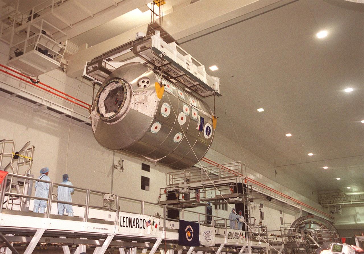 In the Space Station Processing Facility, the Multi-Purpose Logistics Module Leonardo, suspended from an overhead crane, glides across the room to a payload canister for transfer to Launch Pad 39B and installation in Space Shuttle Discovery. The Leonardo, one of Italy’s major contributions to the International Space Station program, is a reusable logistics carrier. It is the primary delivery system used to resupply and return Station cargo requiring a pressurized environment. Leonardo is the primary payload on mission STS-102 and will deliver up to 10 tons of laboratory racks filled with equipment, experiments and supplies for outfitting the newly installed U.S. Laboratory Destiny. STS-102 is scheduled to launch March 8 at 6:45 a.m. EST