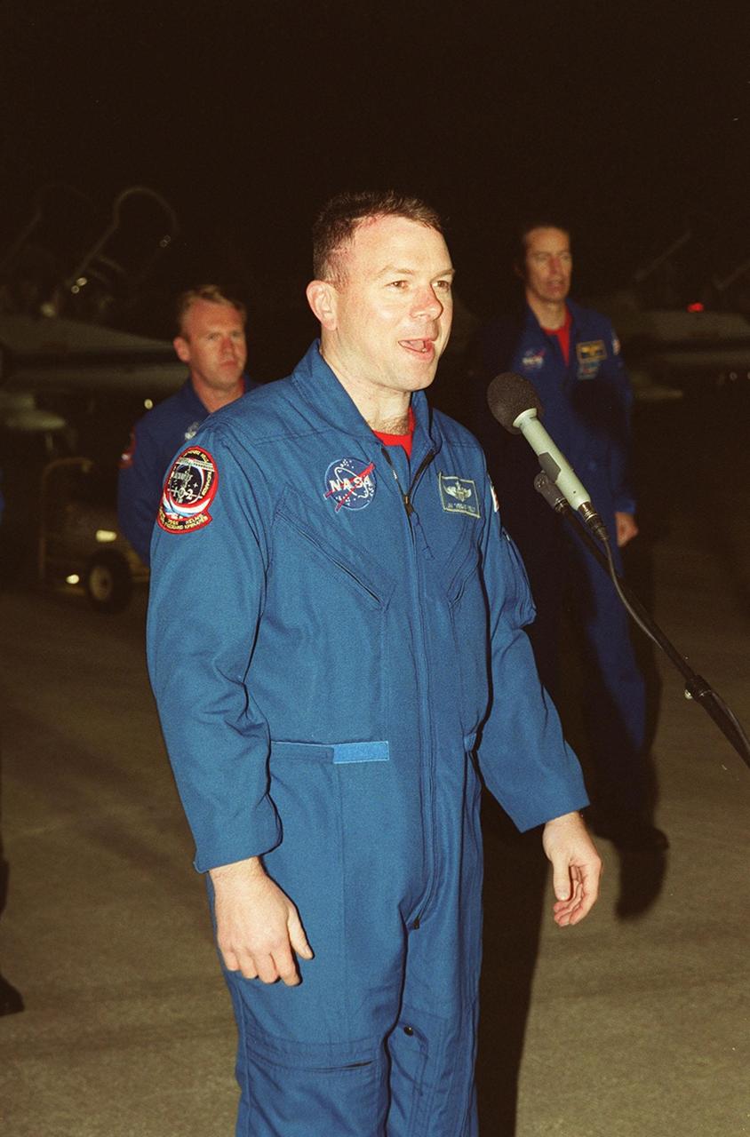 After arrival at the Shuttle Landing Facility, STS-102 Pilot James Kelly addresses the media. Behind him are Mission Specialist Andrew Thomas (left) and Commander James Wetherbee (right). The crew is making the eighth construction flight to the International Space Station. STS-102 will be carrying the Multi-Purpose Logistics Module Leonardo, the primary delivery system used to resupply and return Station cargo requiring a pressurized environment. Leonardo will deliver up to 10 tons of laboratory racks filled with equipment, experiments and supplies for outfitting the newly installed U.S. Laboratory Destiny. STS-102 is scheduled to launch March 8 at 6:42 a.m. EST