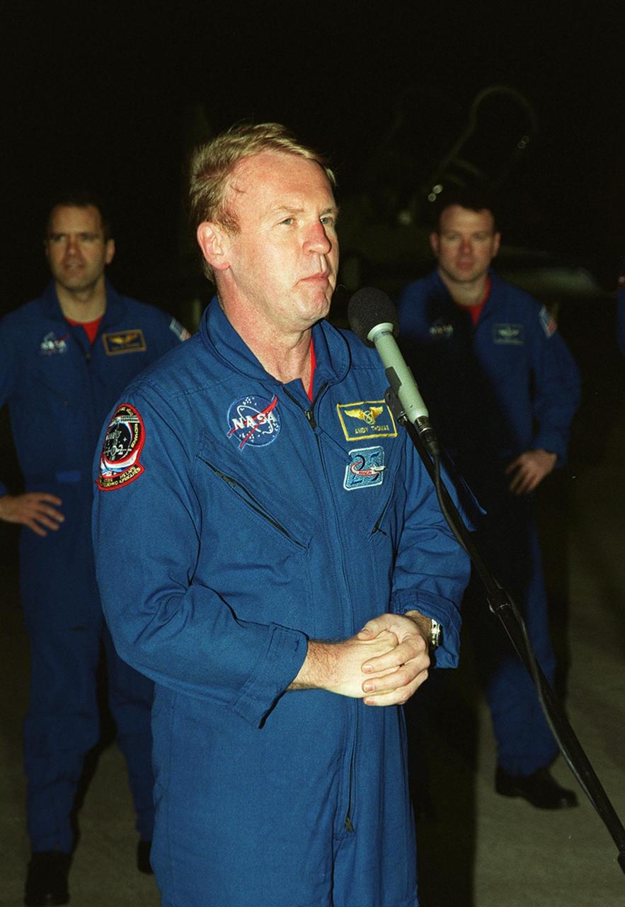 After arrival at the Shuttle Landing Facility, STS-102 Mission Specialist Andrew Thomas addresses the media. Behind him are Mission Specialist Paul Richards (left) and Pilot James Kelly (right). The crew is making the eighth construction flight to the International Space Station. STS-102 will be carrying the Multi-Purpose Logistics Module Leonardo, the primary delivery system used to resupply and return Station cargo requiring a pressurized environment. Leonardo will deliver up to 10 tons of laboratory racks filled with equipment, experiments and supplies for outfitting the newly installed U.S. Laboratory Destiny. STS-102 is scheduled to launch March 8 at 6:42 a.m. EST