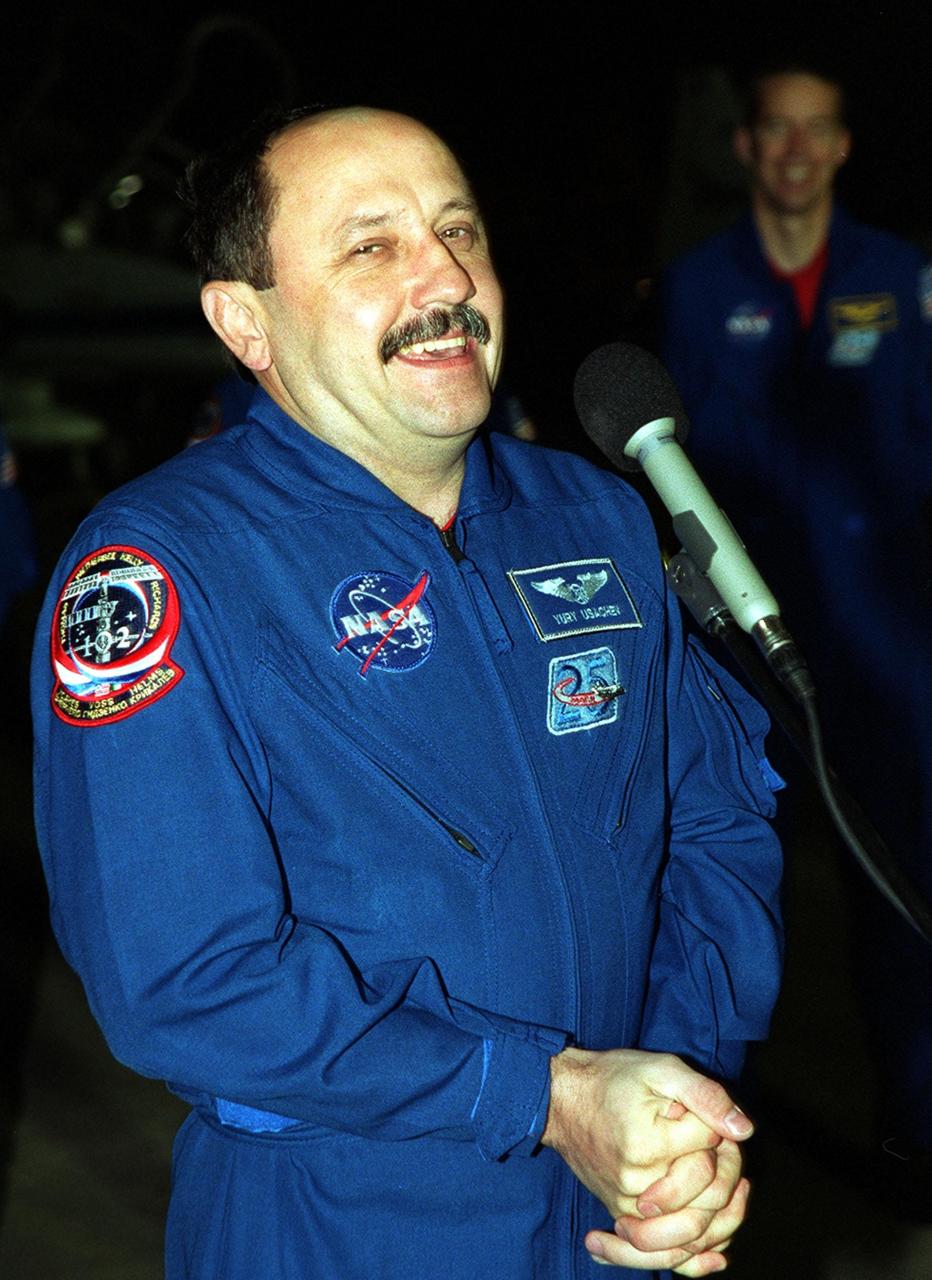 After arrival at the Shuttle Landing Facility, STS-102 Mission Specialist Yury Usachev laughs at a comment from the media. At the right can be seen Commander James Wetherbee. The crew is making the eighth construction flight to the International Space Station. In addition, Usachev is part of the Expedition Two crew who will be replacing Expedition One on the Station. STS-102 will be carrying the Multi-Purpose Logistics Module Leonardo, the primary delivery system used to resupply and return Station cargo requiring a pressurized environment. Leonardo will deliver up to 10 tons of laboratory racks filled with equipment, experiments and supplies for outfitting the newly installed U.S. Laboratory Destiny. STS-102 is scheduled to launch March 8 at 6:42 a.m. EST