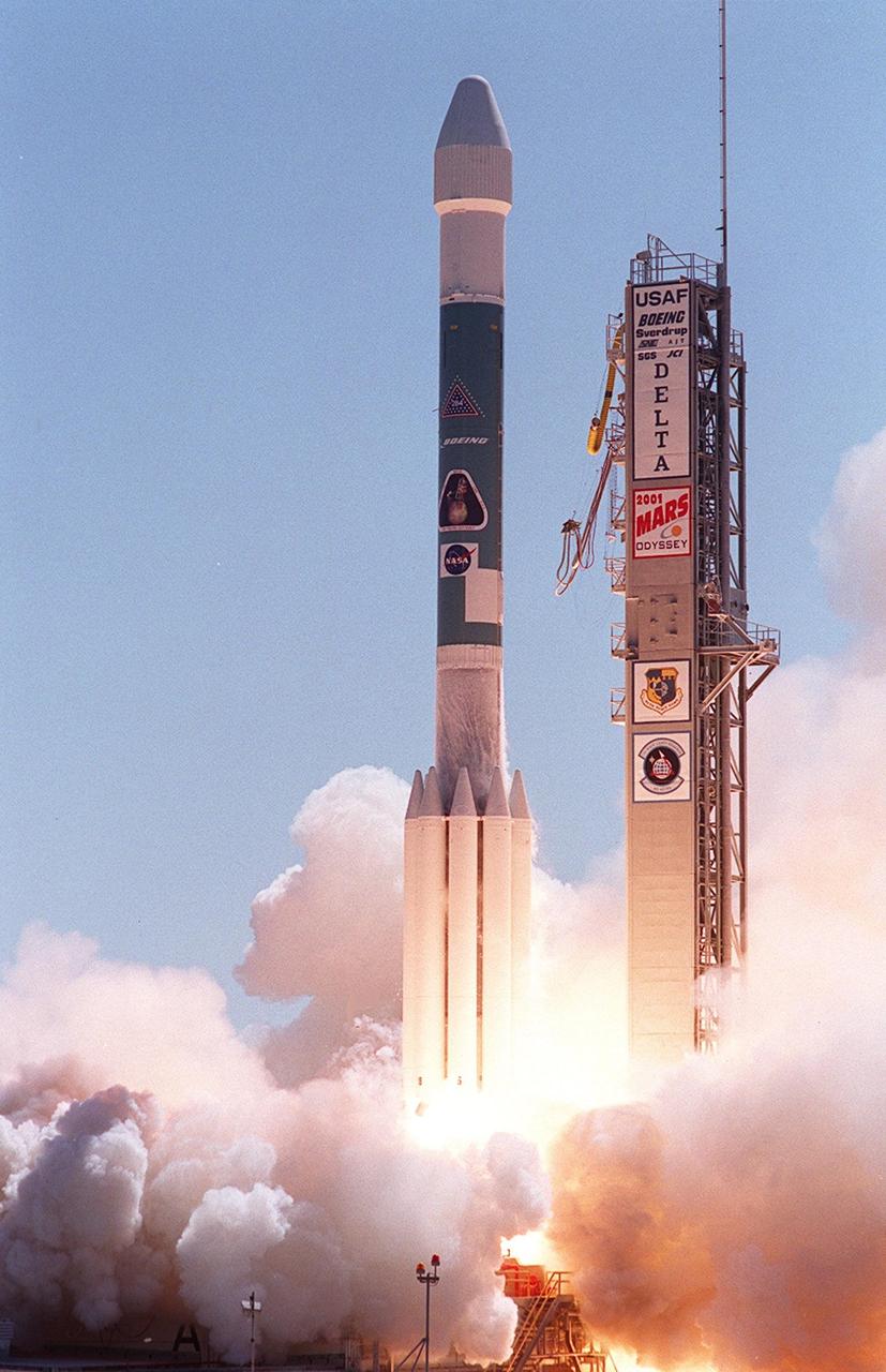 The Boeing Delta II rocket carrying the 2001 Mars Odyssey spacecraft leaps through the smoke into a clear blue sky. Liftoff occurred at 11:02 a.m. EDT. The launch sends the Mars Odyssey on an approximate 7-month journey to orbit the planet Mars. The spacecraft, built by Lockheed Martin Space Systems for the Jet Propulsion Laboratory, will map the Martian surface looking for geological features that could indicate the presence of water, now or in the past. Science gathered by three science instruments on board will be key to future missions to Mars, including orbital reconnaissance, lander and human missions