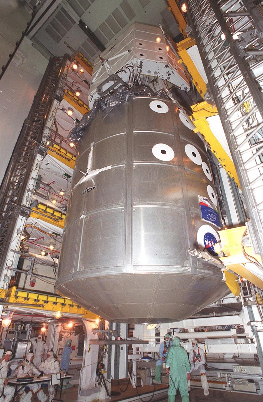  At Launch Pad 39A, the payload on mission STS-100 moves out of the payload canister and into the payload changeout room. At the top is the Canadian robotic arm, the SSRMS, and below it is the Multi-Purpose Logistics Module Raffaello. The SSRMS is capable of handling large payloads and assisting with docking the Space Shuttle. It is crucial to the continued assembly of the International Space Station. Raffaello carries six system racks and two storage racks for the U.S. Lab. Launch of mission STS-100 is scheduled for April 19 at 2:41 p.m. EDT