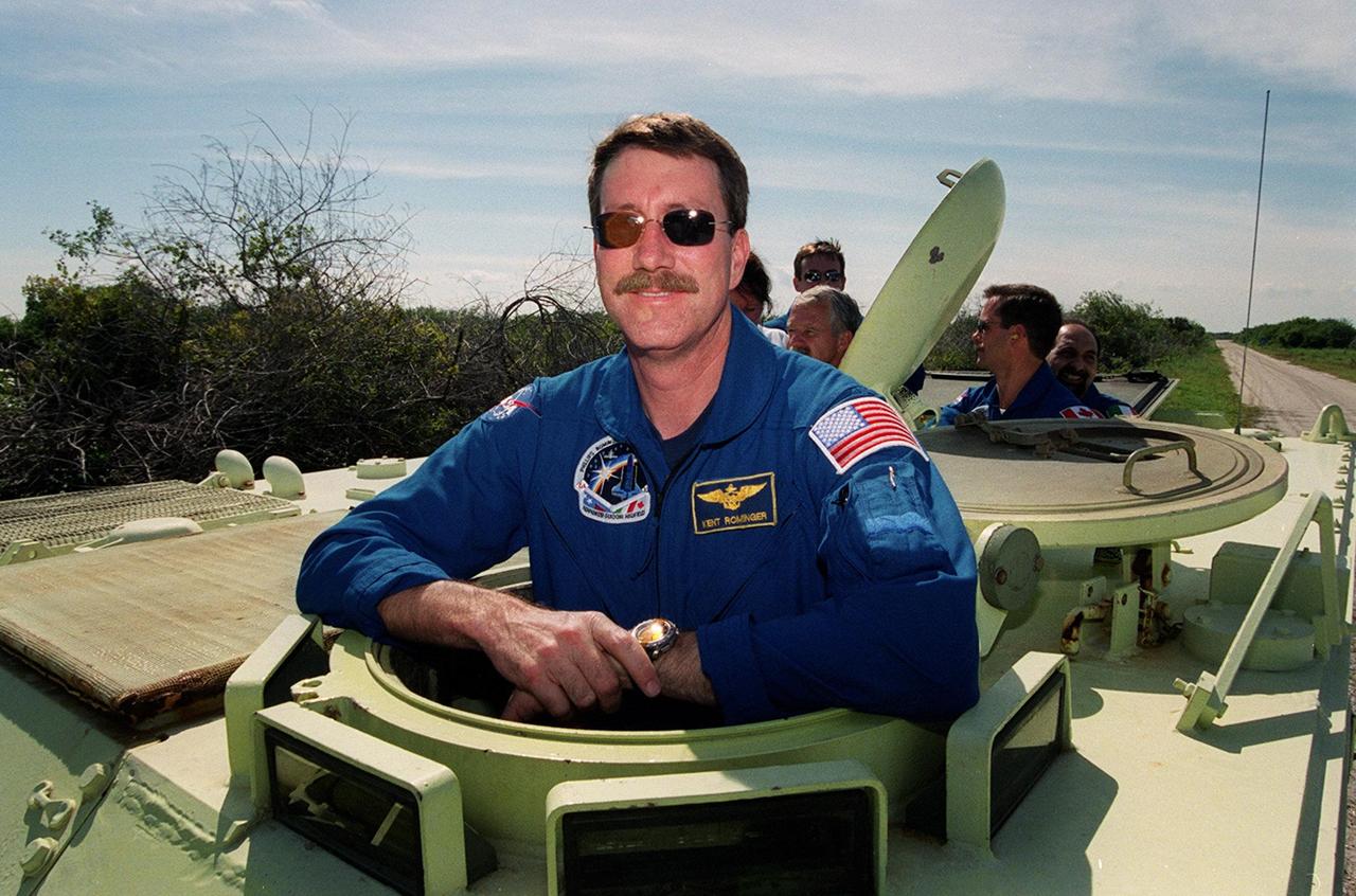 STS-100 Commander Kent V. Rominger is ready to take the wheel on the M-113 armored carrier that could be used by the crew in the event of an emergency at the pad during which the crew must make a quick exit from the area. Driving the tracked vehicle is part of Terminal Countdown Demonstration Test activities, which include emergency escape training, payload walkdown and a simulated launch countdown. The primary payload on mission STS-100 comprises the Canadian robotic arm, SSRMS, and Multi-Purpose Logistics Module, Raffaello. Launch of Space Shuttle Endeavour on mission STS-100 is targeted for April 19 at 2:41 p.m. EDT from Launch Pad 39A